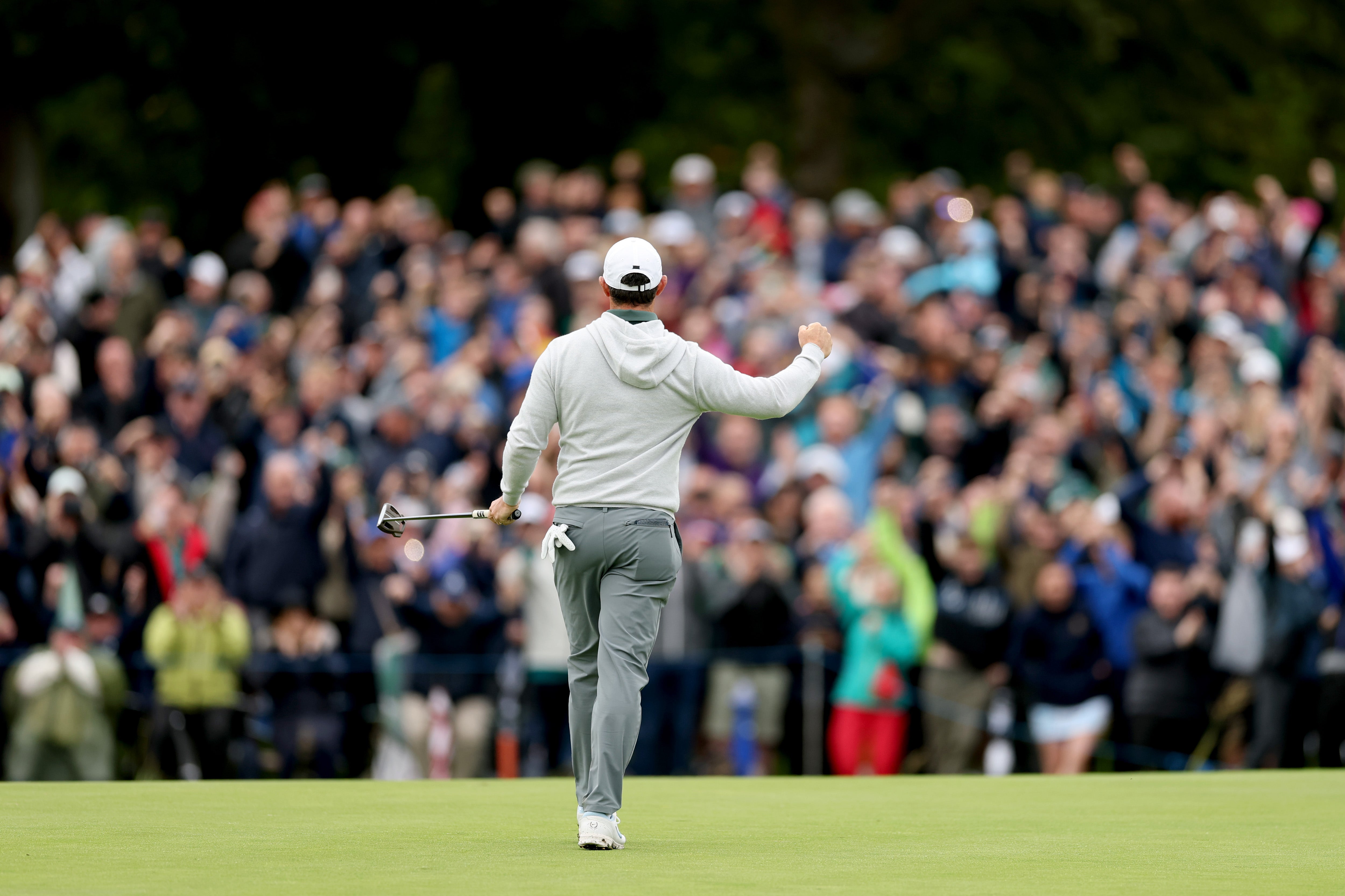 Rory McIlroy celebrates an eagle putt on the 18th green