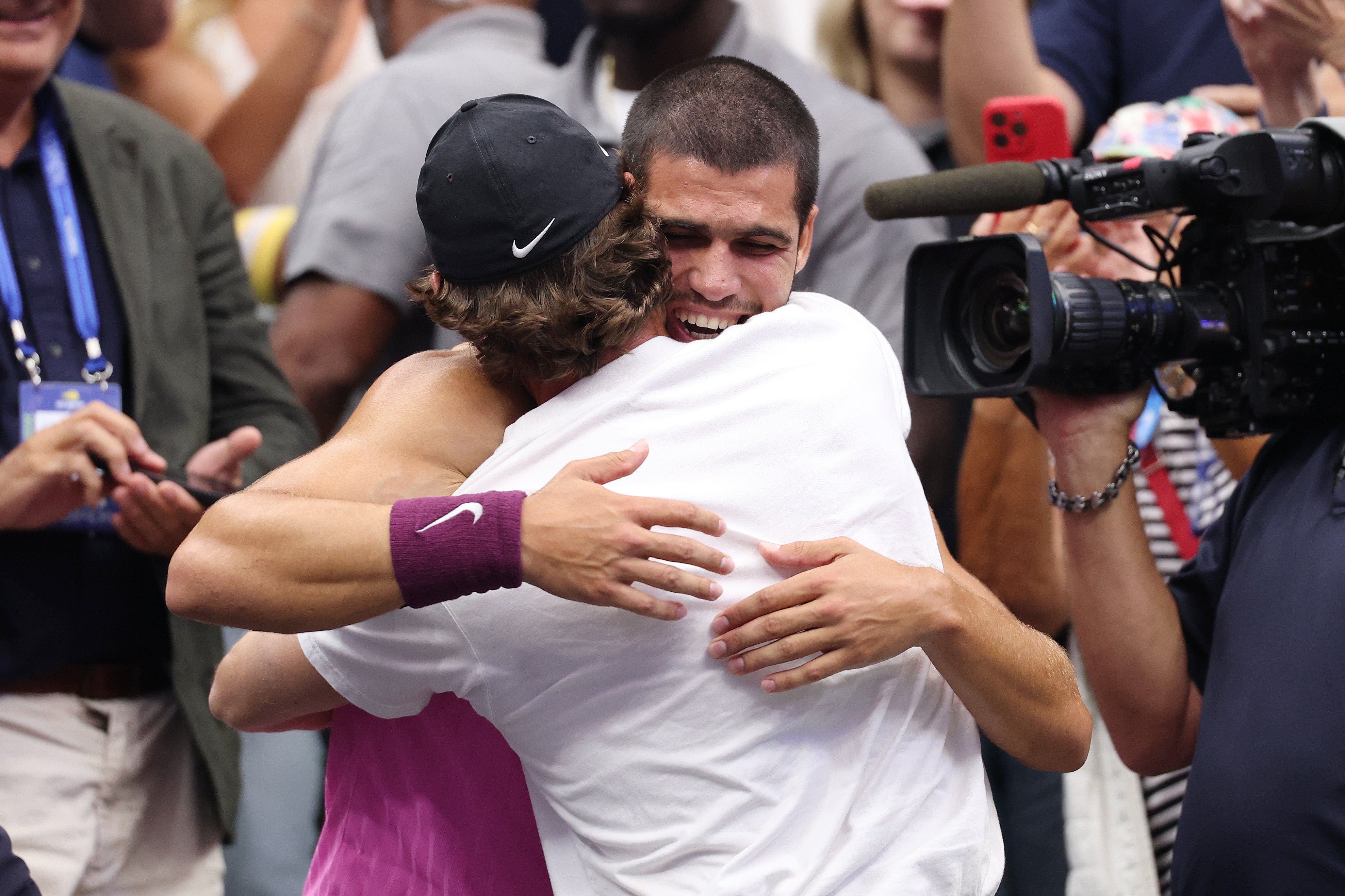Alcaraz celebrates with coach, Juan Carlos Ferrero, after winning a sixth grand slam title