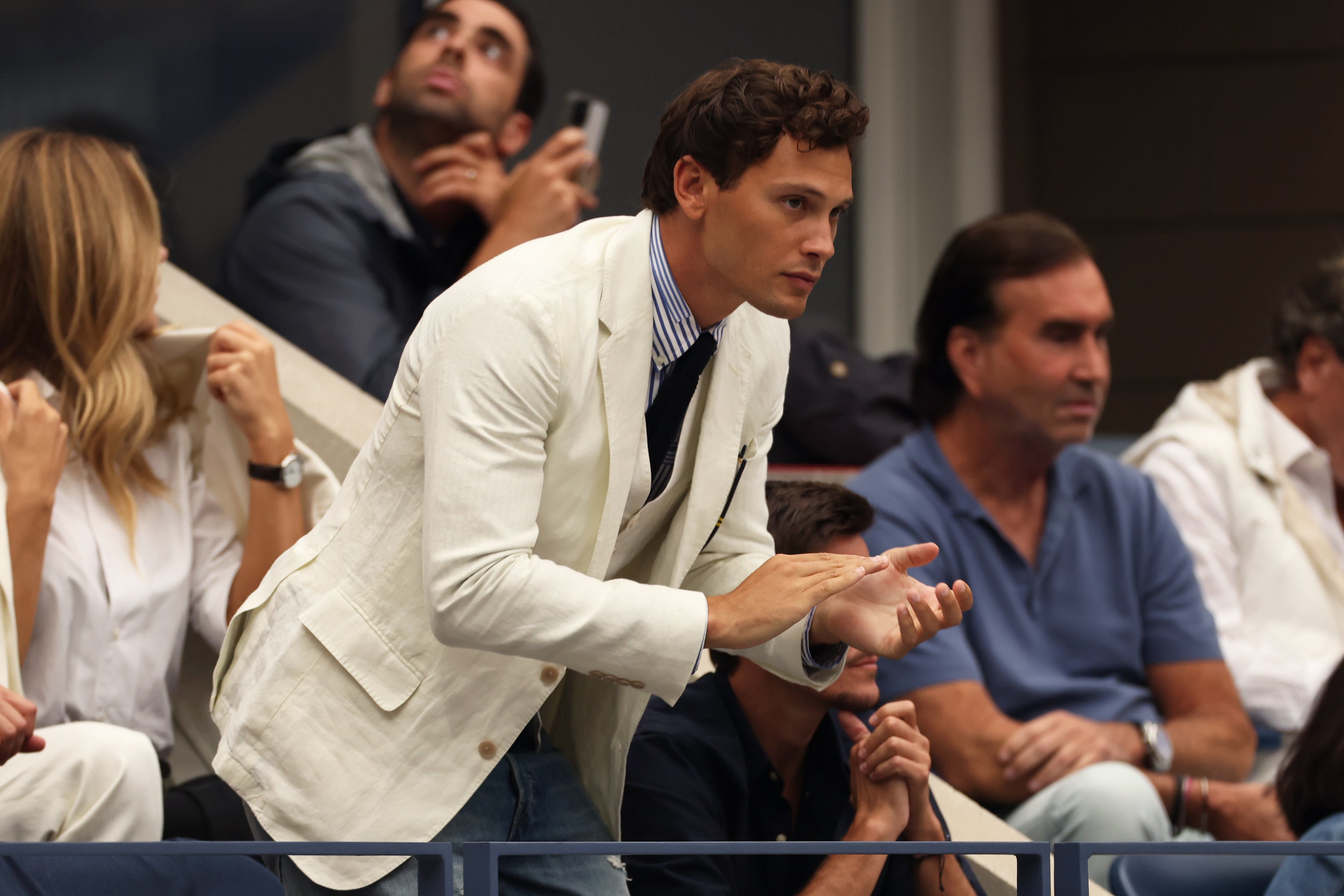 'Monsters' breakout Cooper Koch cheeers from the stands at the 2025 U.S. Open men's final