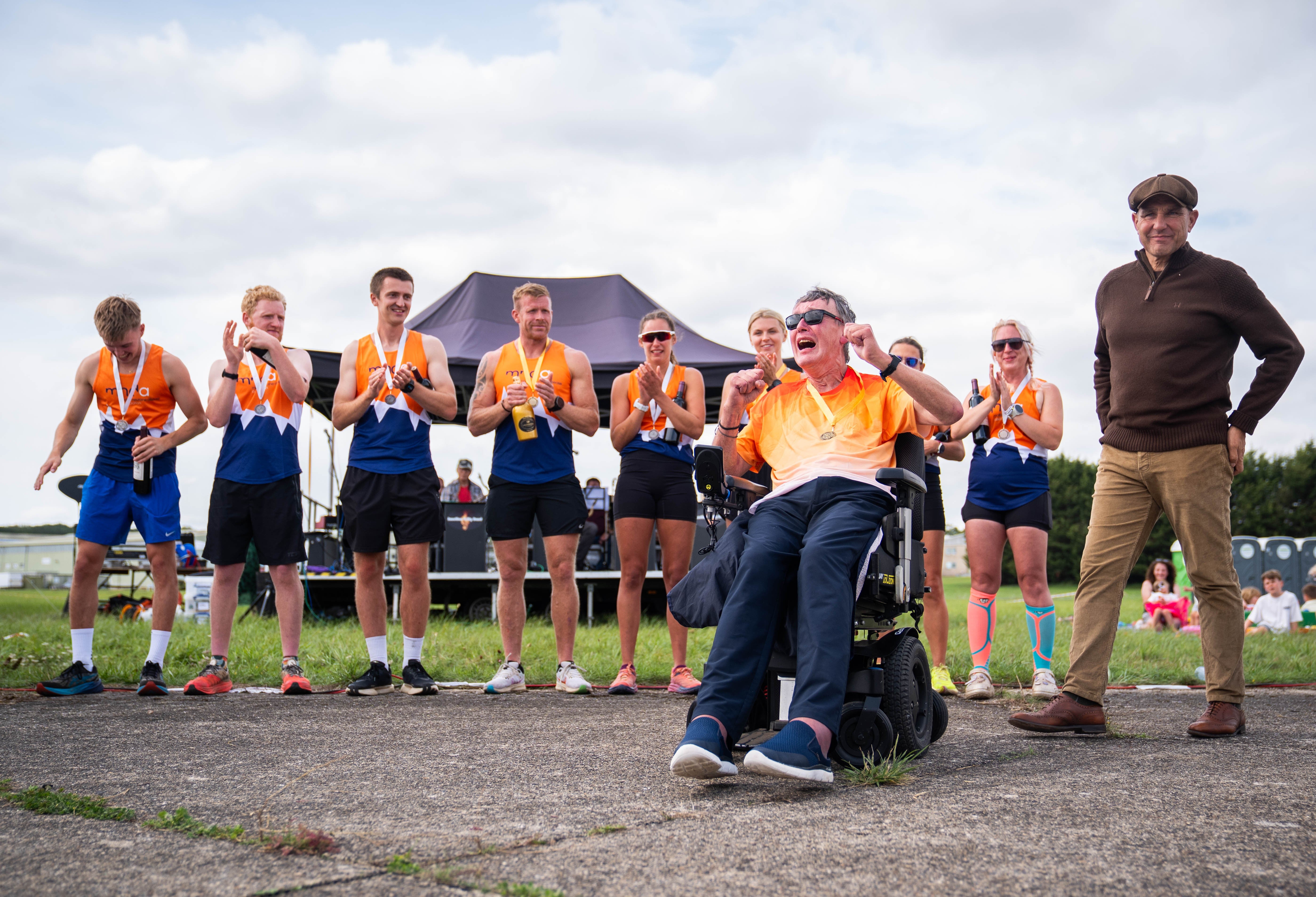 Paul having broken the records, with Vinnie Jones to his right