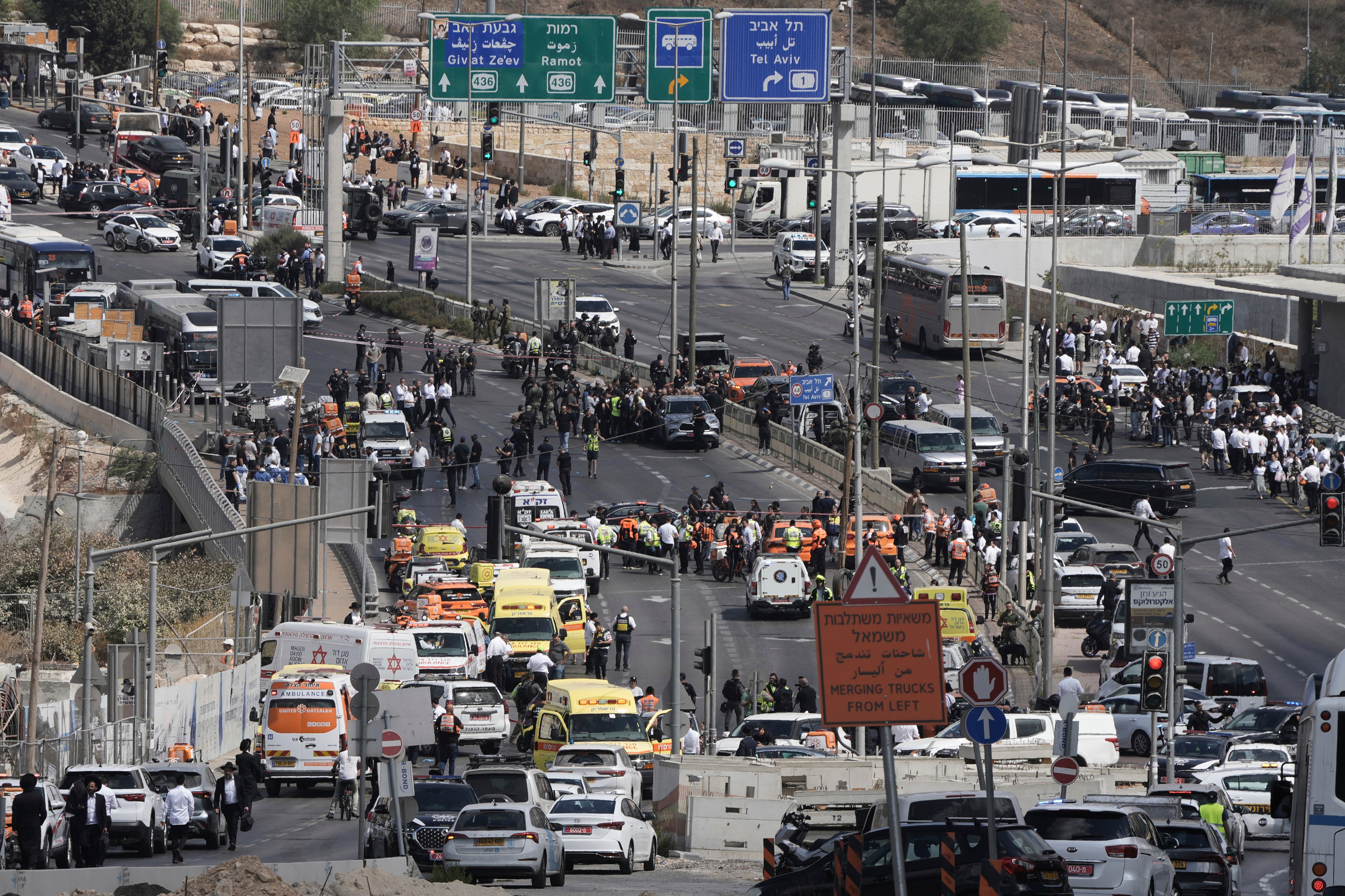 Israeli police and rescue teams respond at the scene of a shooting attack where several people killed and injured in Jerusalem