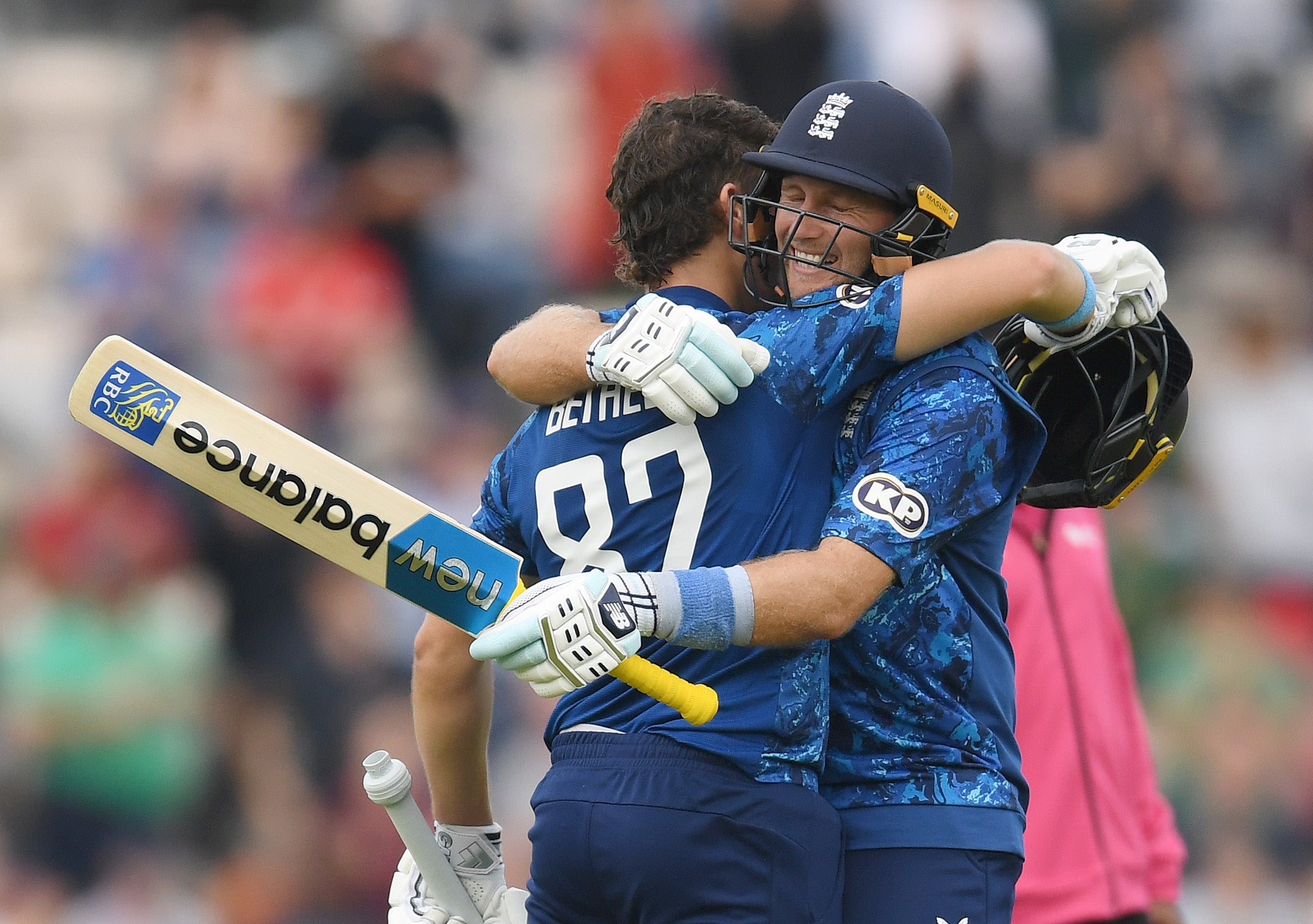 Joe Root hugs Jacob Bethell (L) after Bethell reached his century during the 3rd Metro Bank ODI between England and South Africa