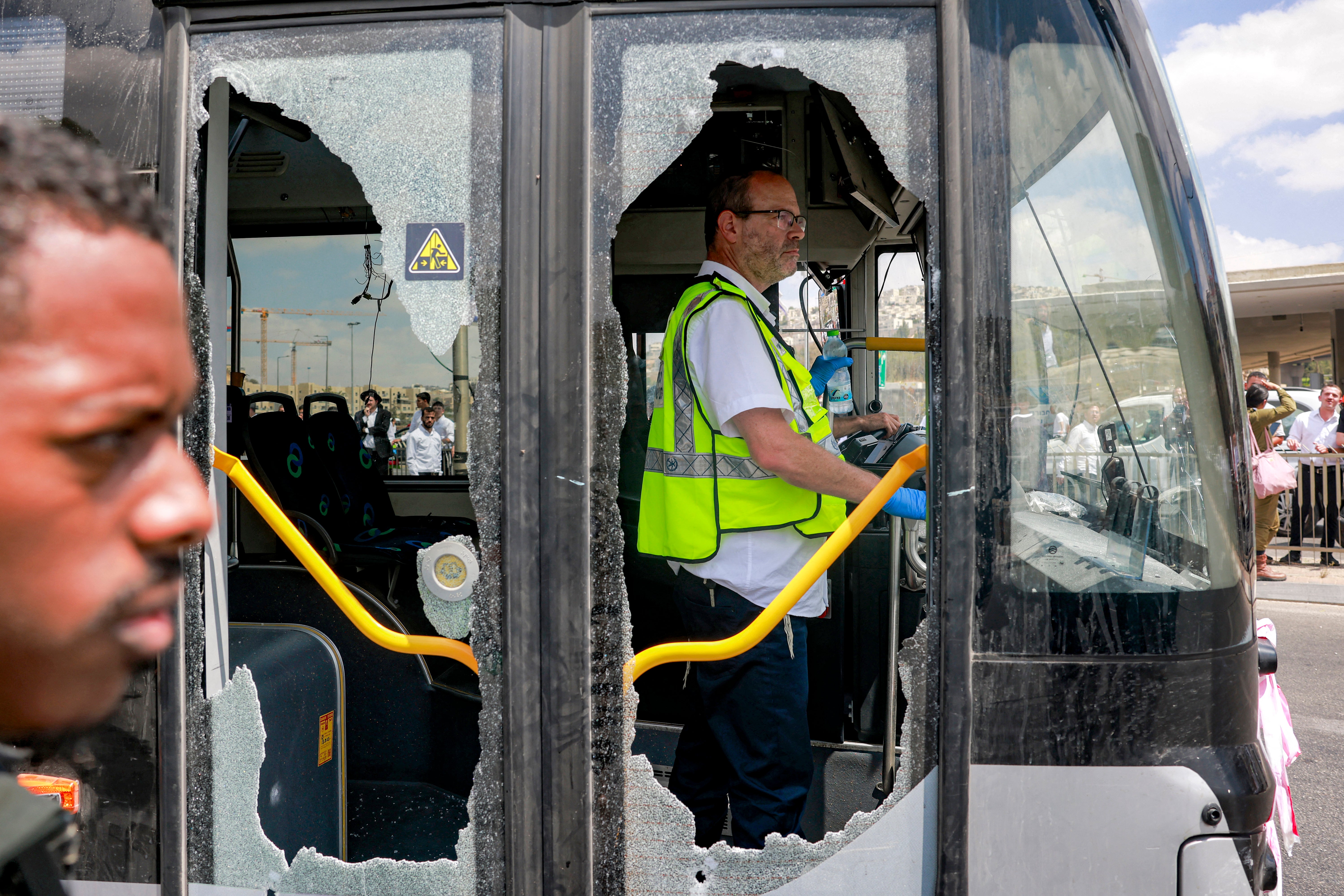 A damaged bus is pictured at the scene of a shooting at the Ramot road junction in Israeli-annexed east Jerusalem on 8 September 2025