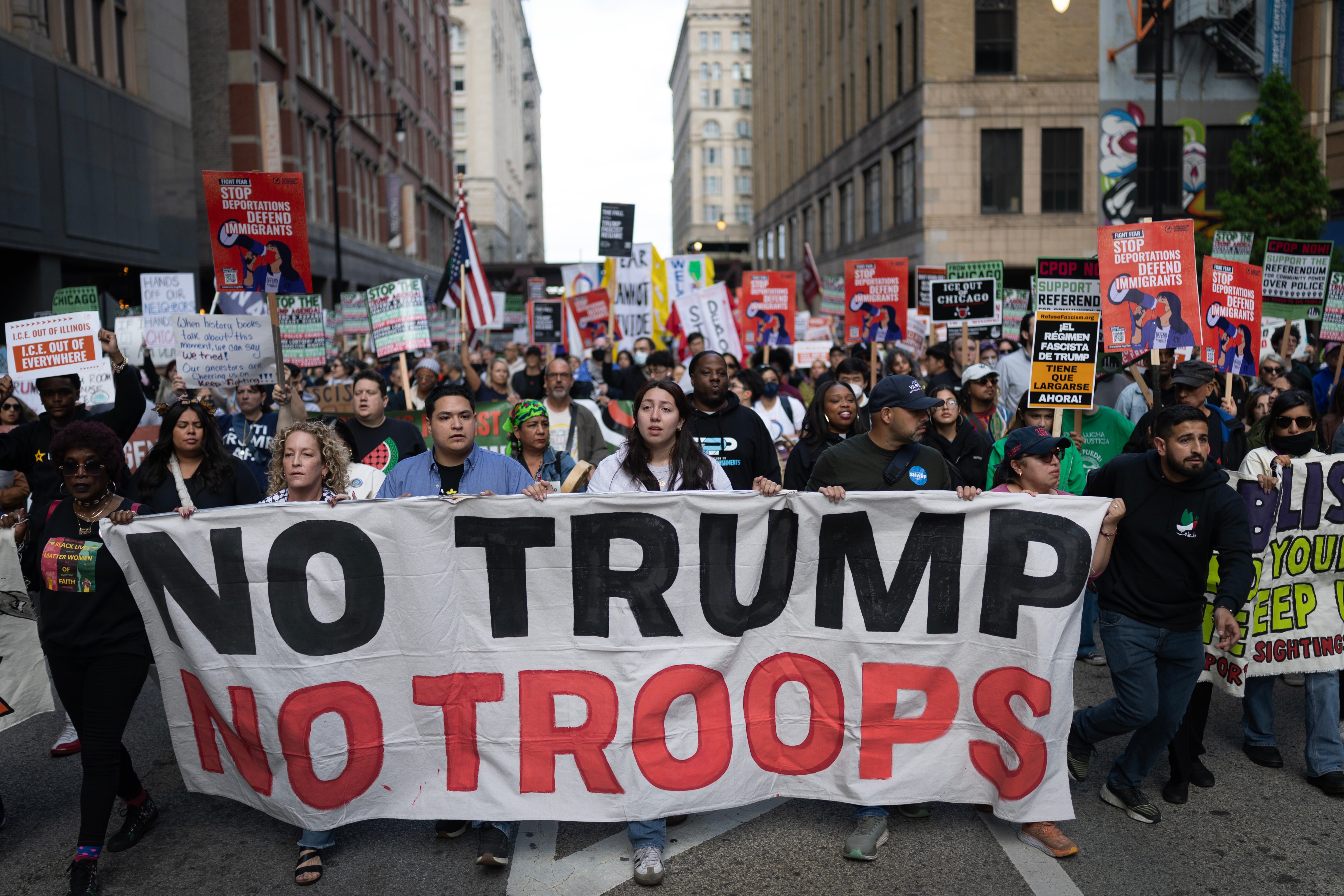Demonstrators march through downtown Chicago on Saturday