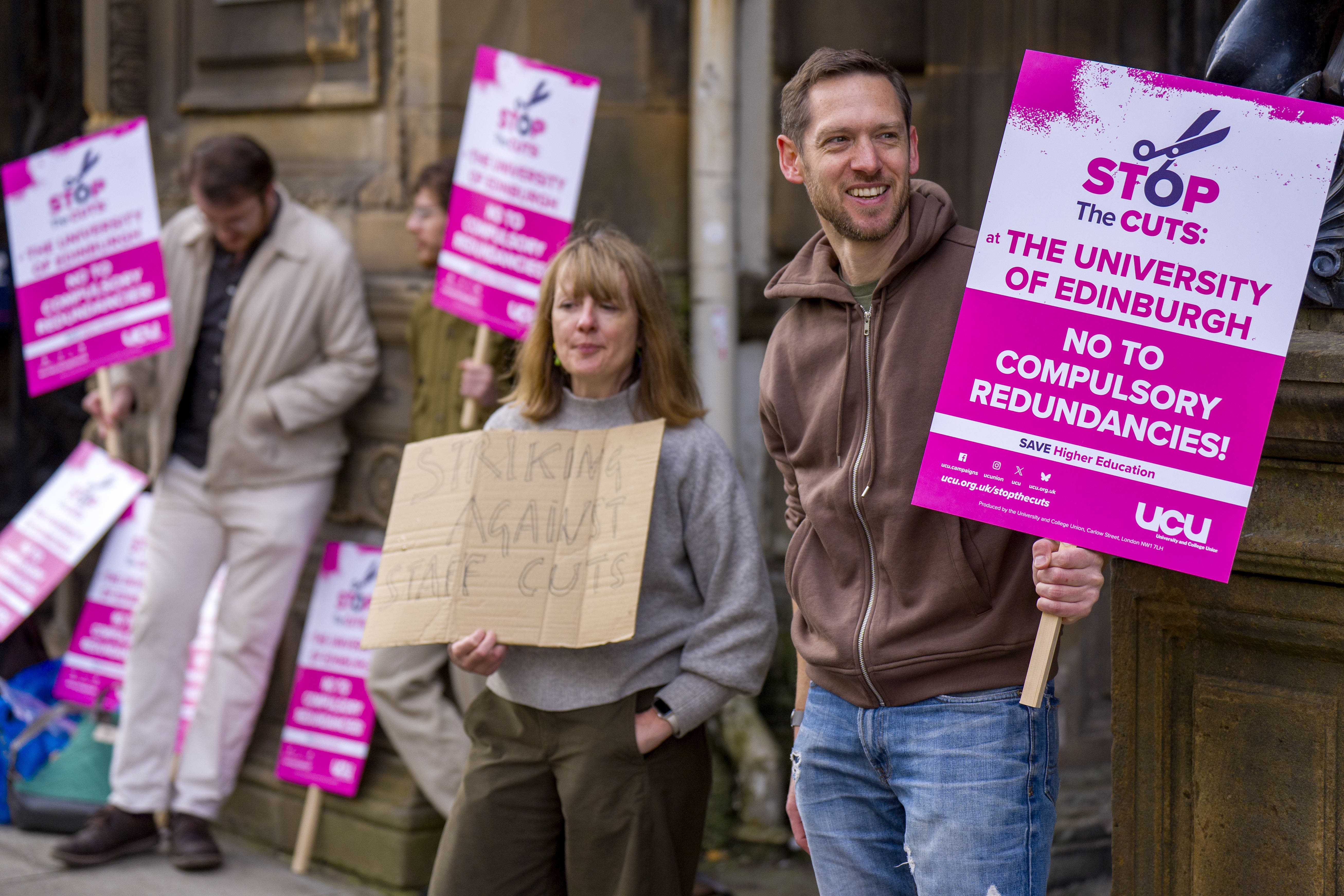 Staff and students at the University of Edinburgh have walked out on the first of five days of industrial action over plans to cut £140 million from the university’s budget (Jane Barlow/PA)