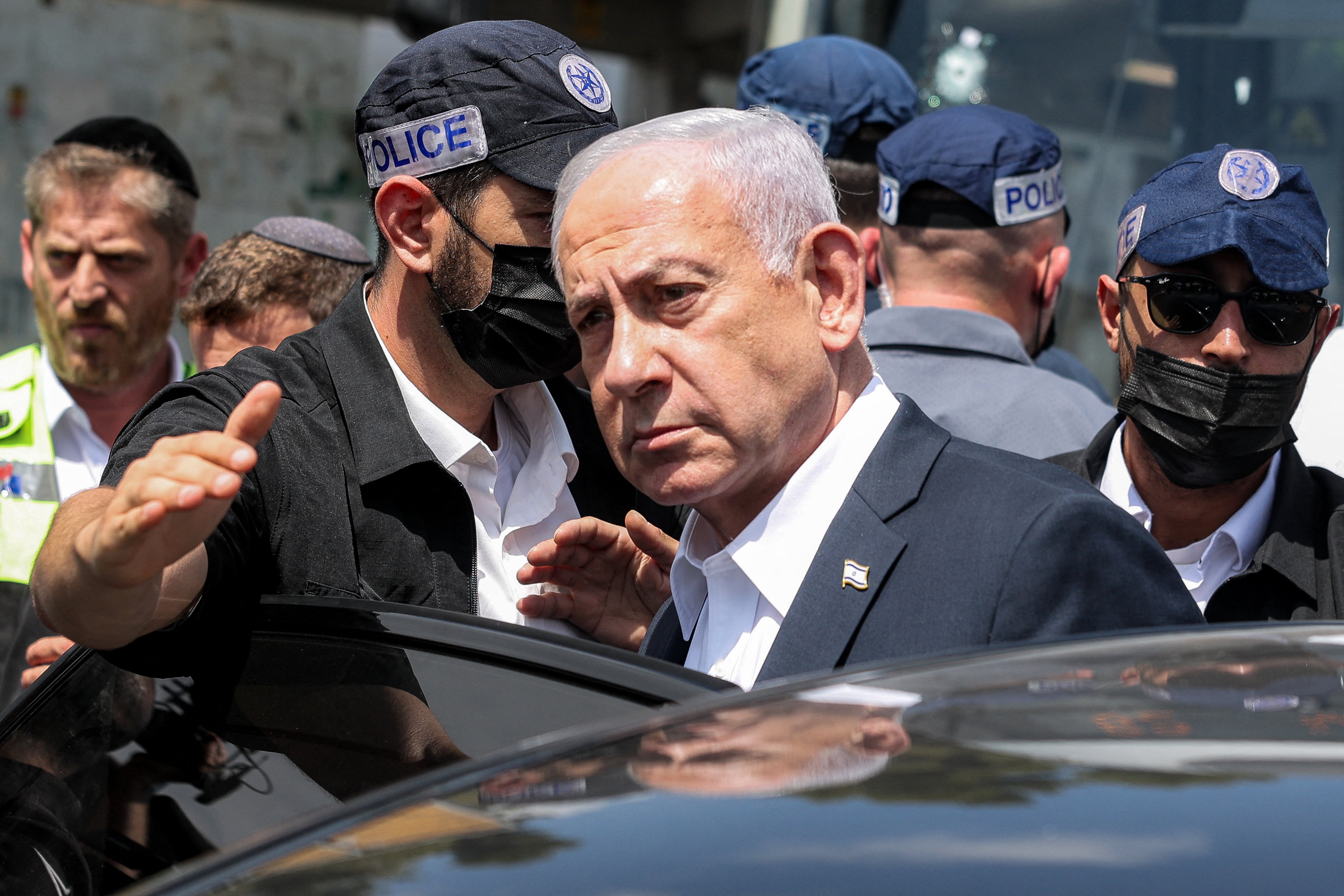 Israel's Prime Minister Benjamin Netanyahu visits the scene of a shooting at the Ramot road junction in Israeli-annexed east Jerusalem on September 8, 2025