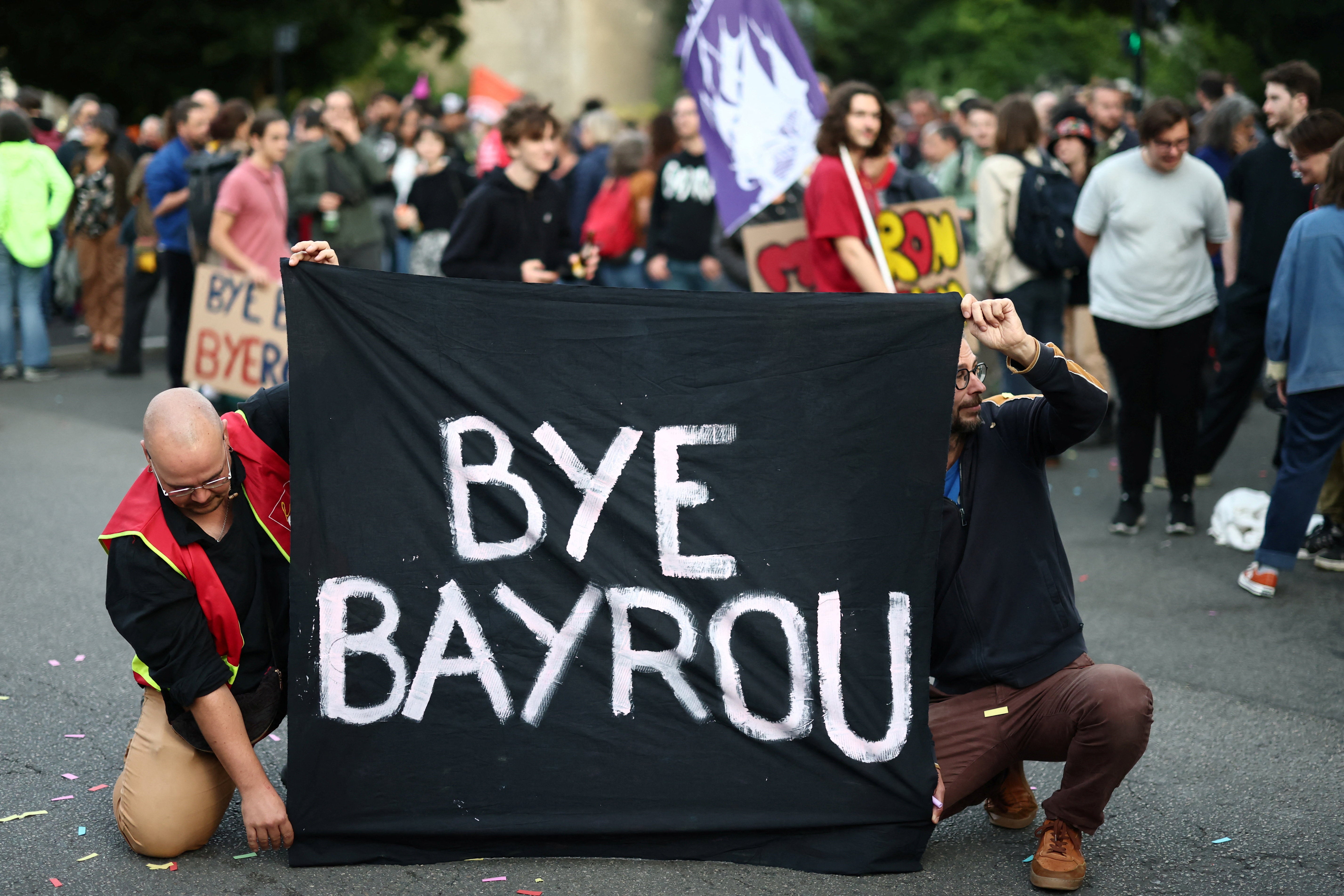 <p>People react after French PM faces defeat in confidence vote in parliament</p>