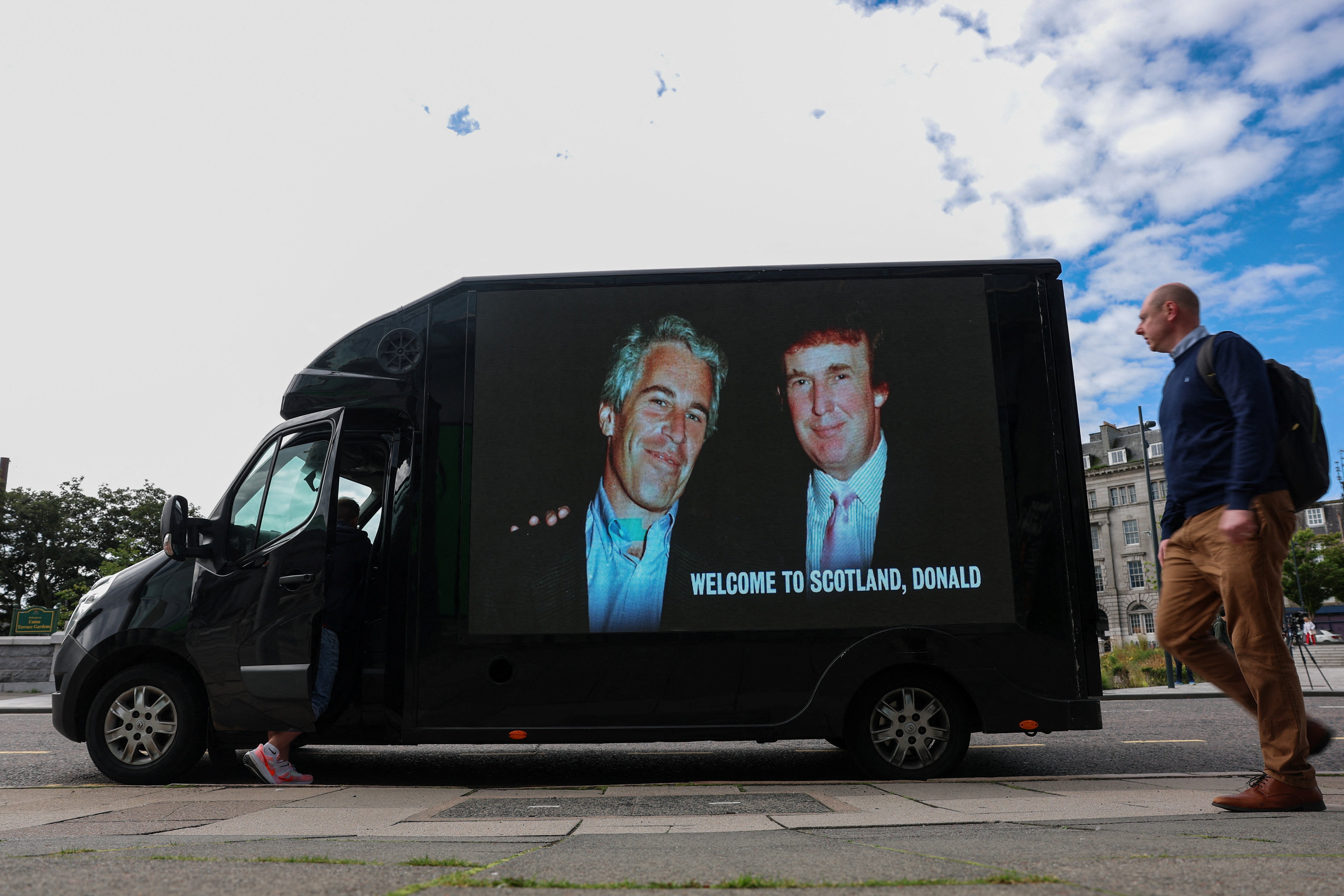 Trump and Epstein appear together in a photo on the side of a van. The estate of Epstein has provided an alleged birthday book to the Oversight Committee as part of Congress’s investigation into the handling of the case