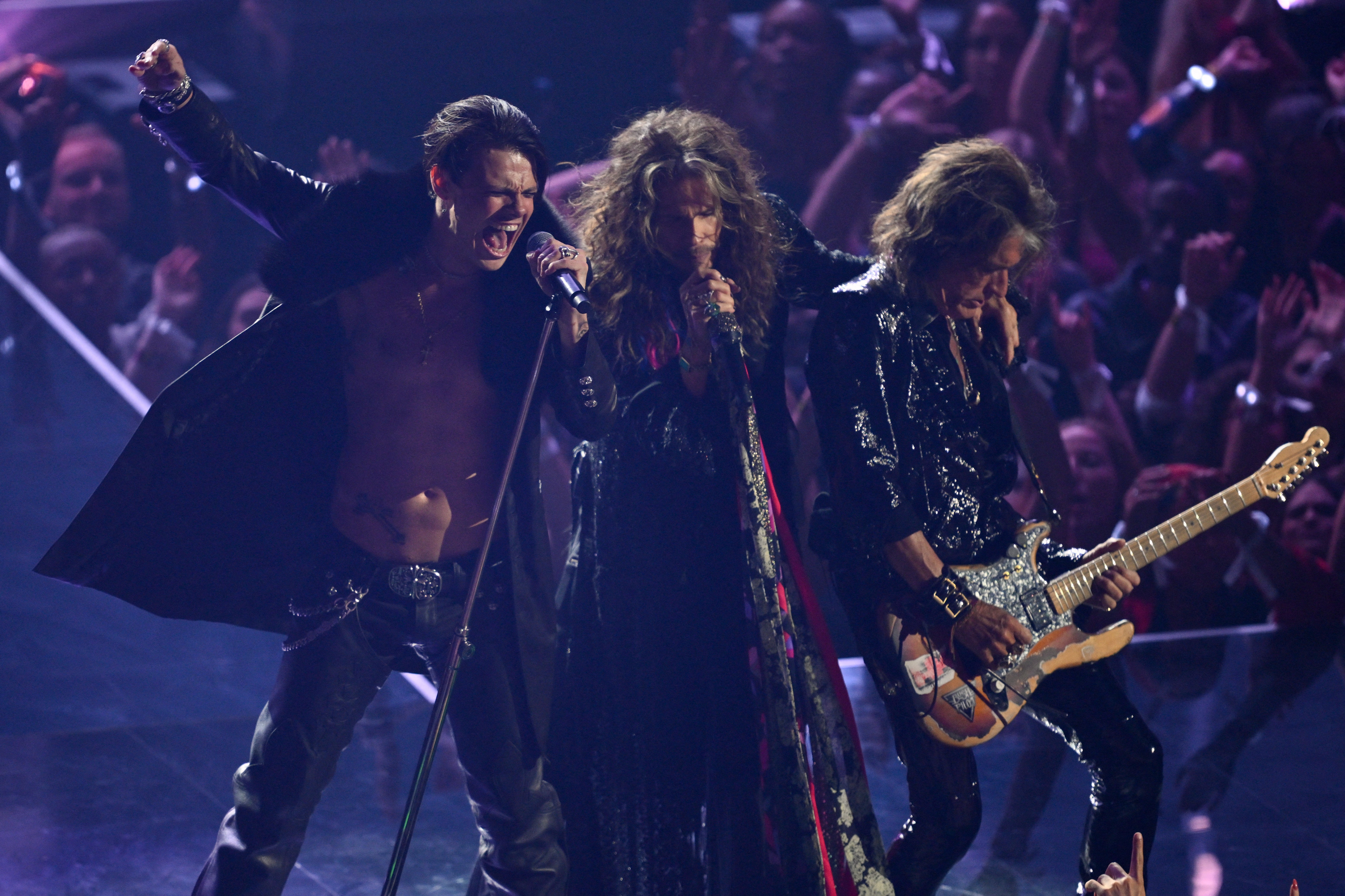 British singer-songwriter Yungblud, US singer-songwriter Steven Tyler and US musician Joe Perry perform on stage during the MTV Video Music Awards 2025