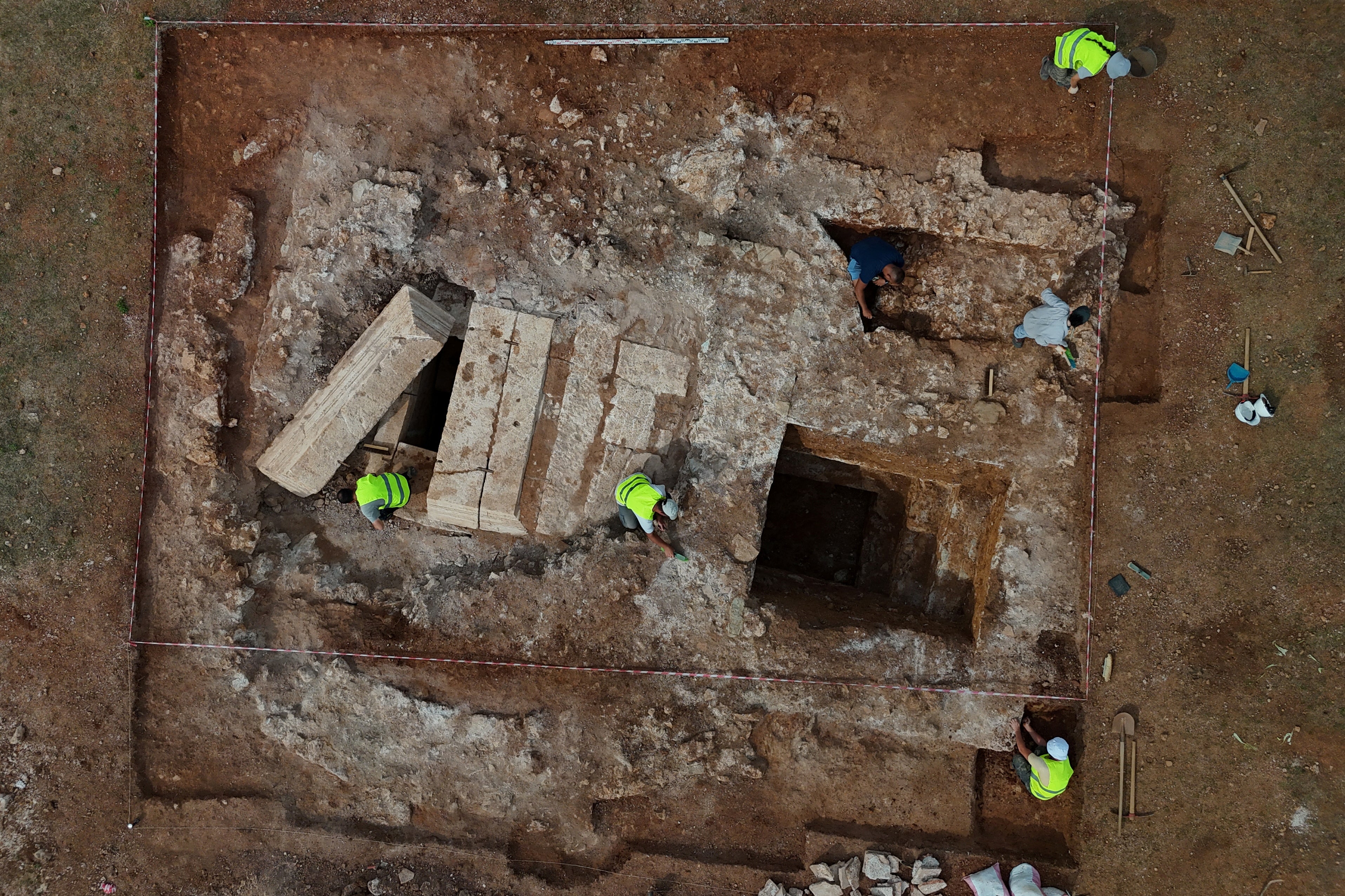 A drone view shows archaeologists working on Albania's first discovered monumental tomb, which they suggest may be a mausoleum, dated to the Roman period III–IV century AD, in Strikcan, Albania, September 4, 2025. REUTERS/Florion Goga