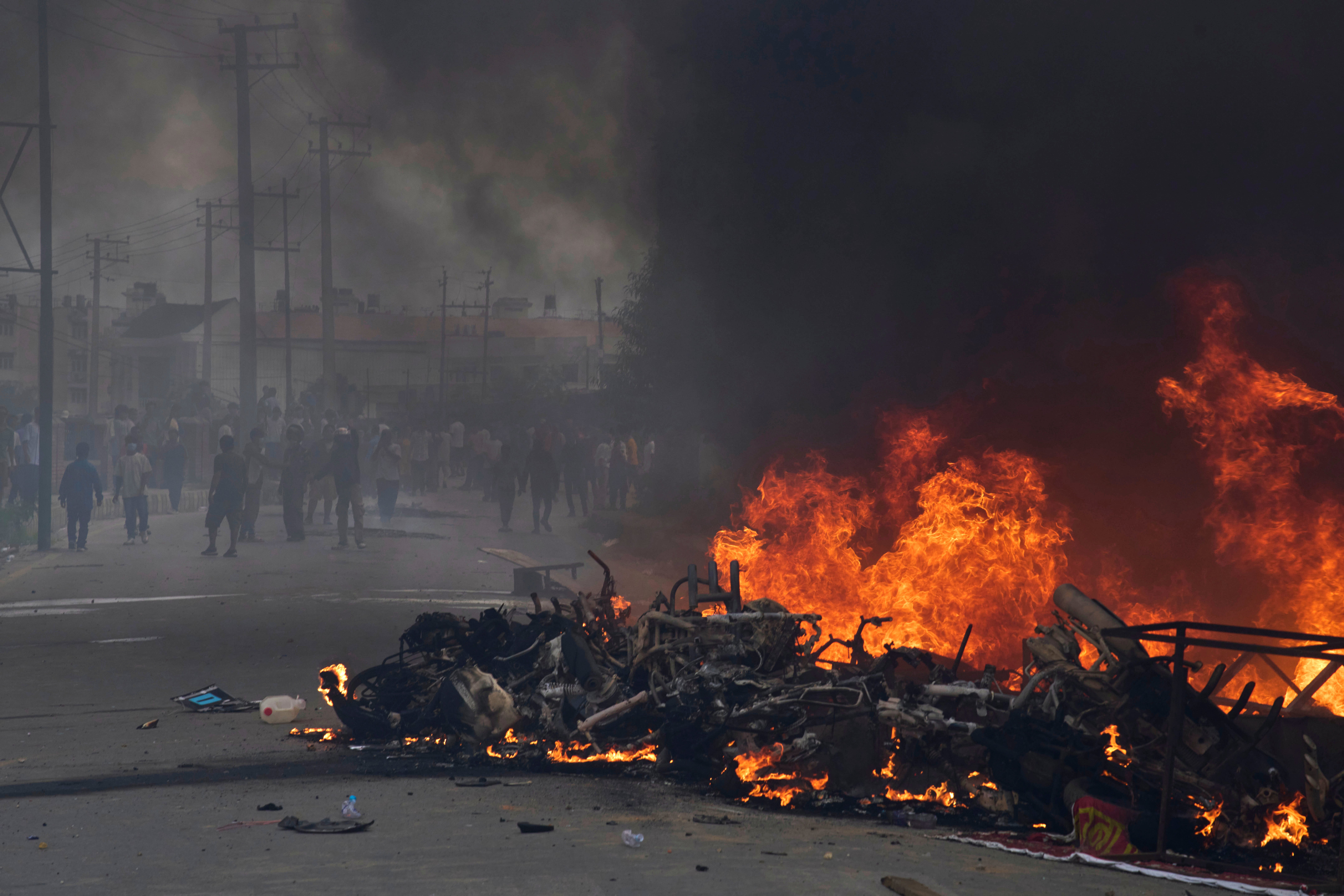 Protesters burn vehicles and tires during protests against social media ban and corruption in Kathmandu