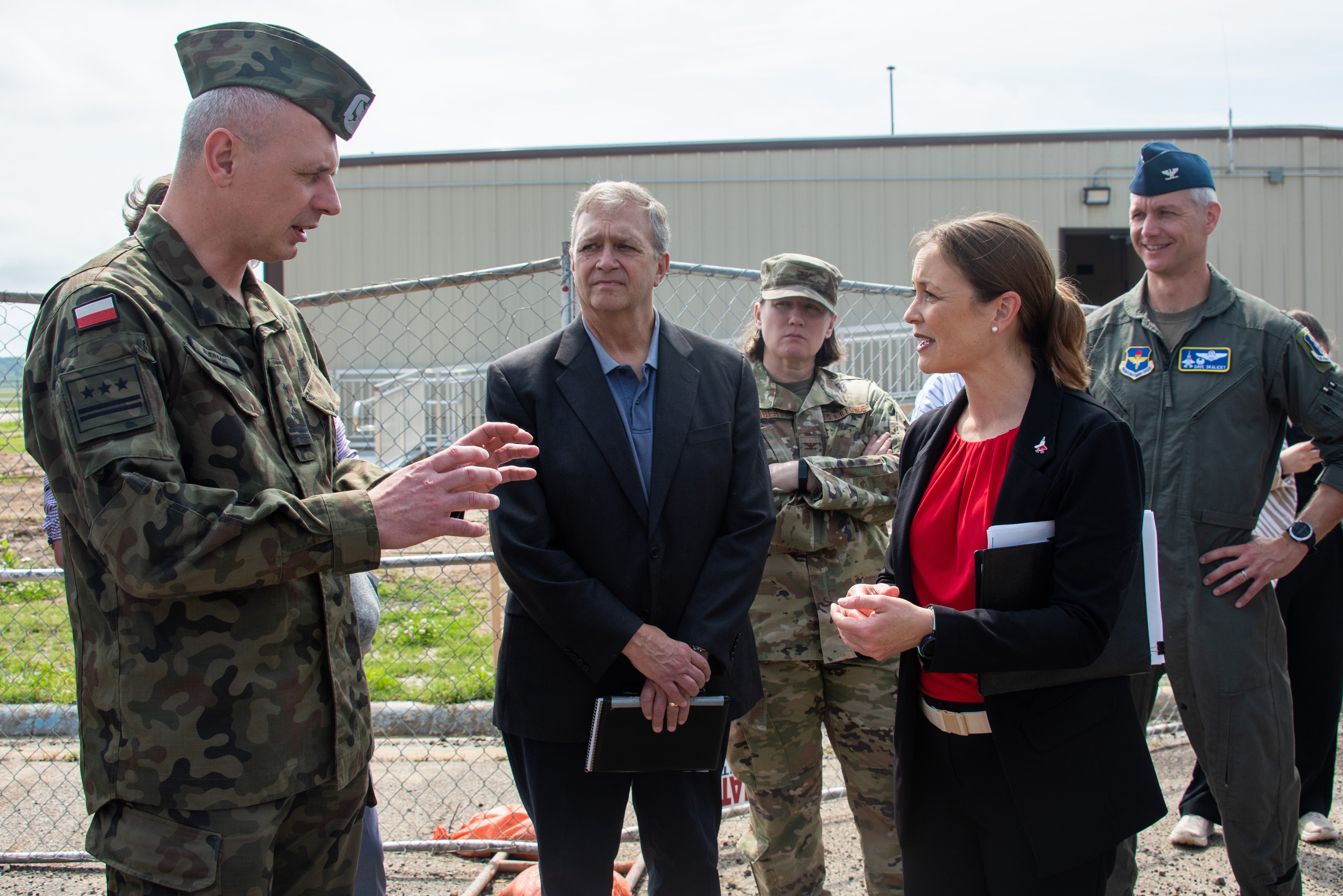 Lockheed Martin F-35 site lead Heidi Moore, seen here in red top and black jacket, is a co-defendant in Richard Roland Jones III's lawsuit against the aerospace and defense behemoth