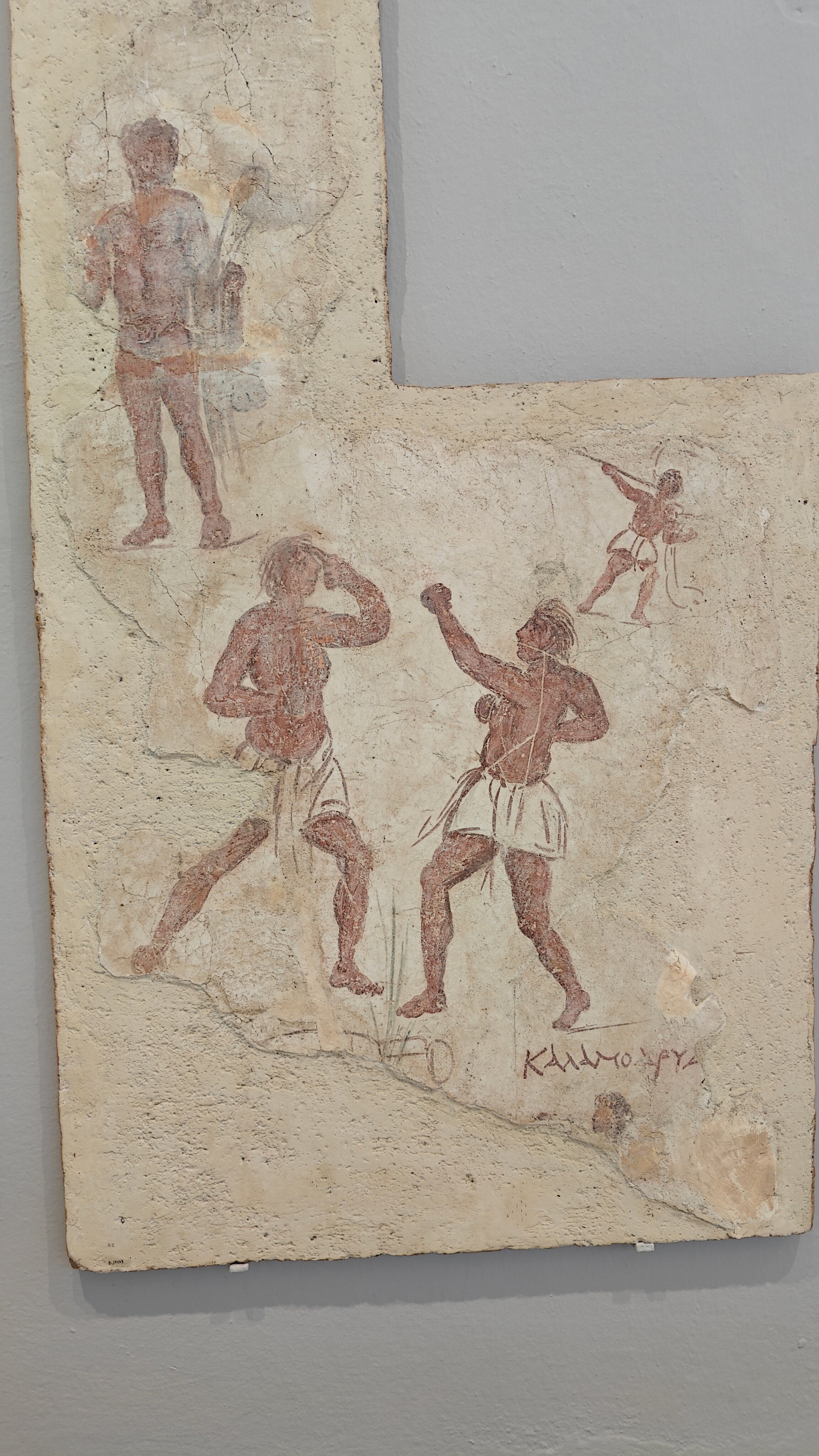 An ancient Greek mural painting portrays a boxing match, giving an insight into the entertainment on Delos