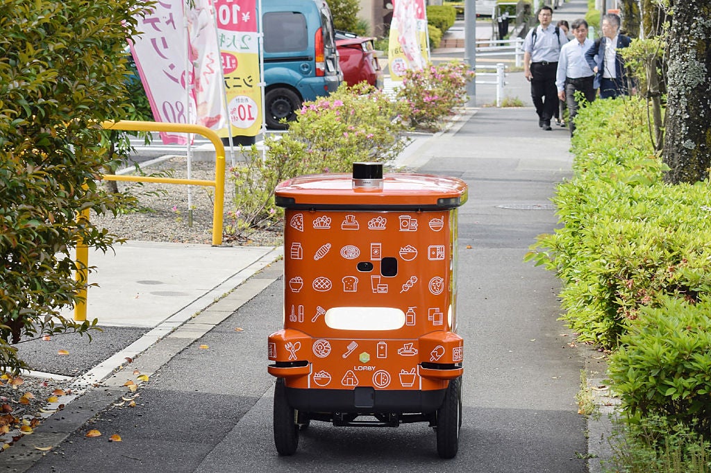 An automated robot on wheels from convenience store chain 7-Eleven delivering items during a demonstration in the Hachioji area of Tokyo on 15 May, 2025