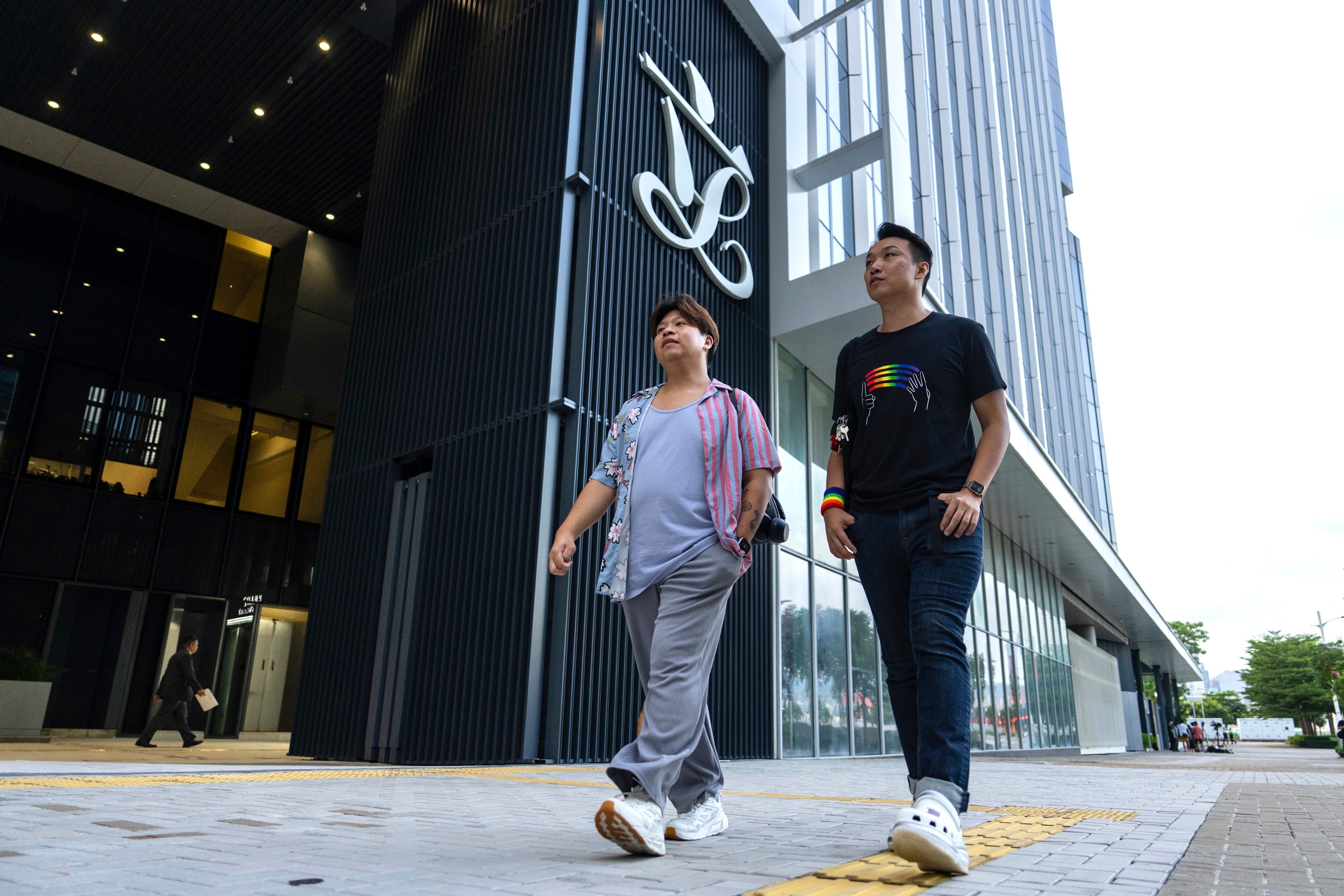 Jimmy Sham, gay rights activists, right, leaves following the legislative debate on a government bill recognising same-sex partnerships, a proposed framework stemming from his successful legal challenge at the top court in Hong Kong, Wednesday, 10 September 2025