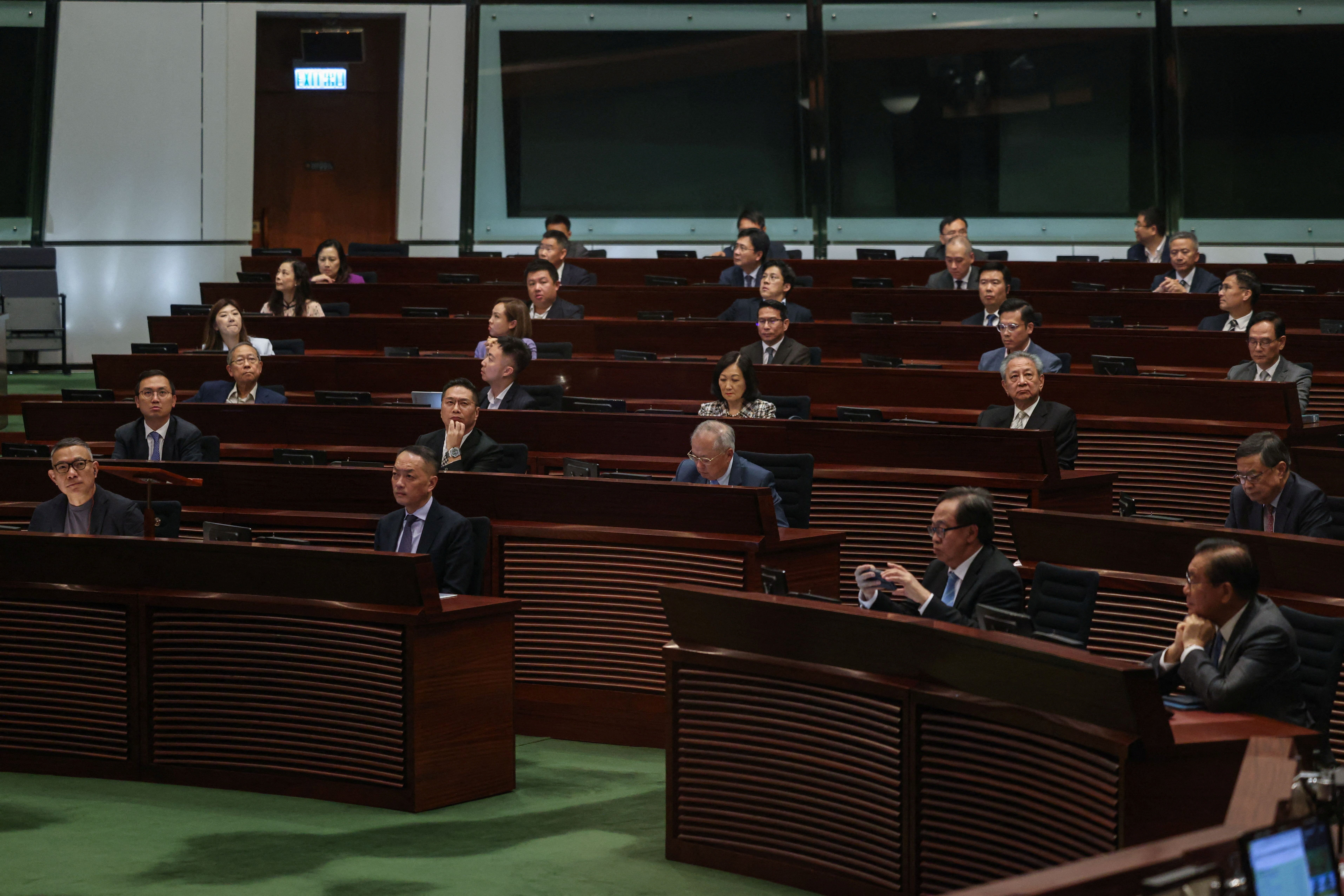 Legislators vote on the registration of same-sex partnerships bill, which allows couples registered abroad to register locally, in the Legislative Council chamber, in Hong Kong, 10 September 2025
