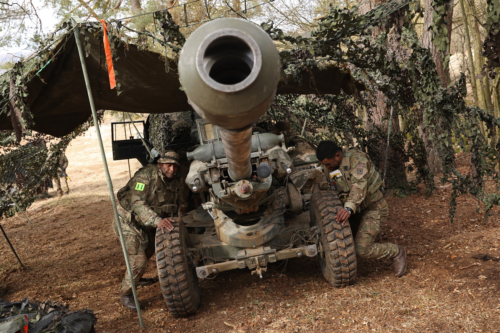 British army soldiers prepare an artillery gun during a military exercise in Hohenfels, Germany, earlier this year