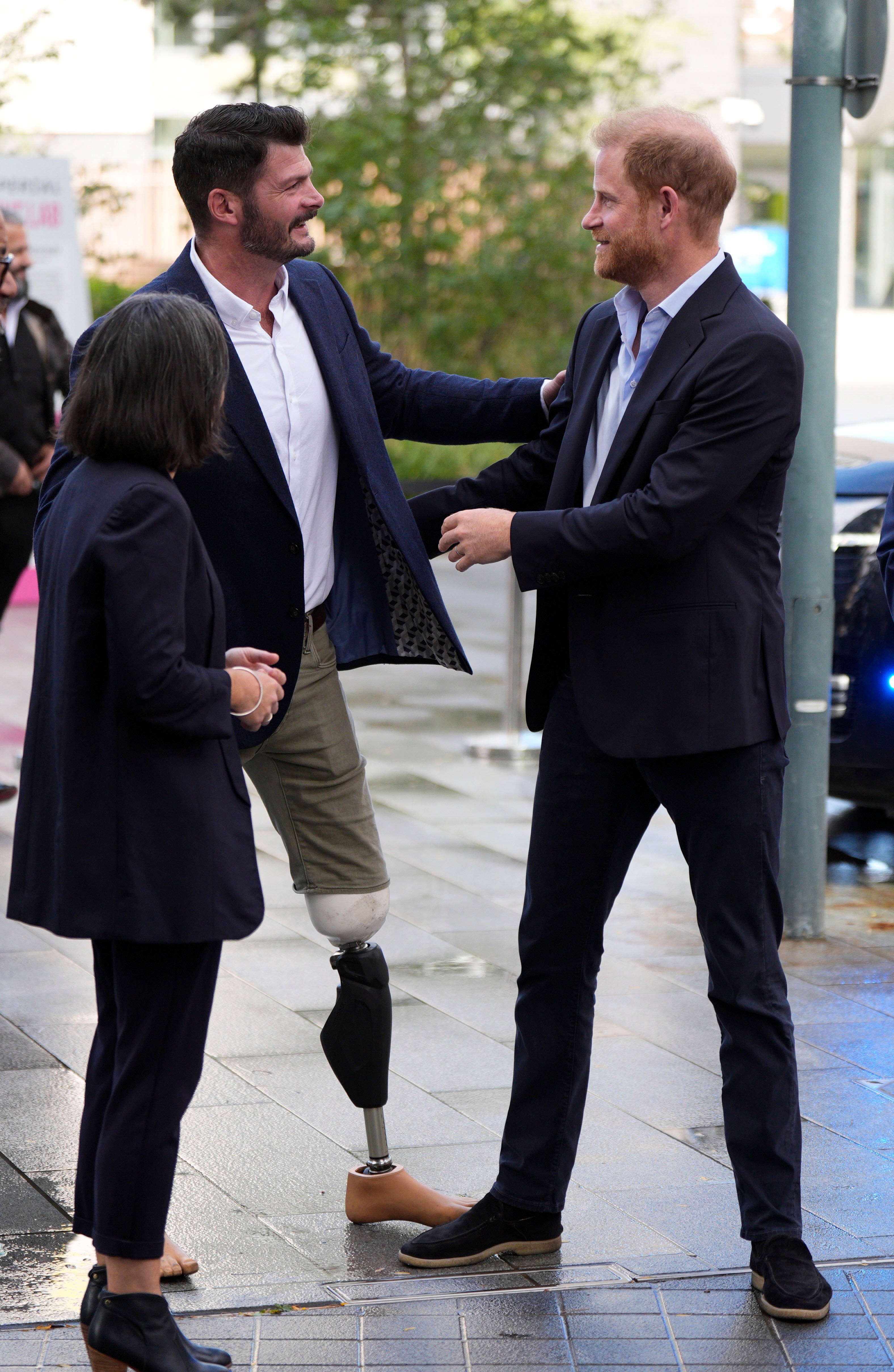 Prince Harry with former army captain and Paralympian David Henson, as he arrives for a visit to Imperial College London's Centre for Blast Injury Studies