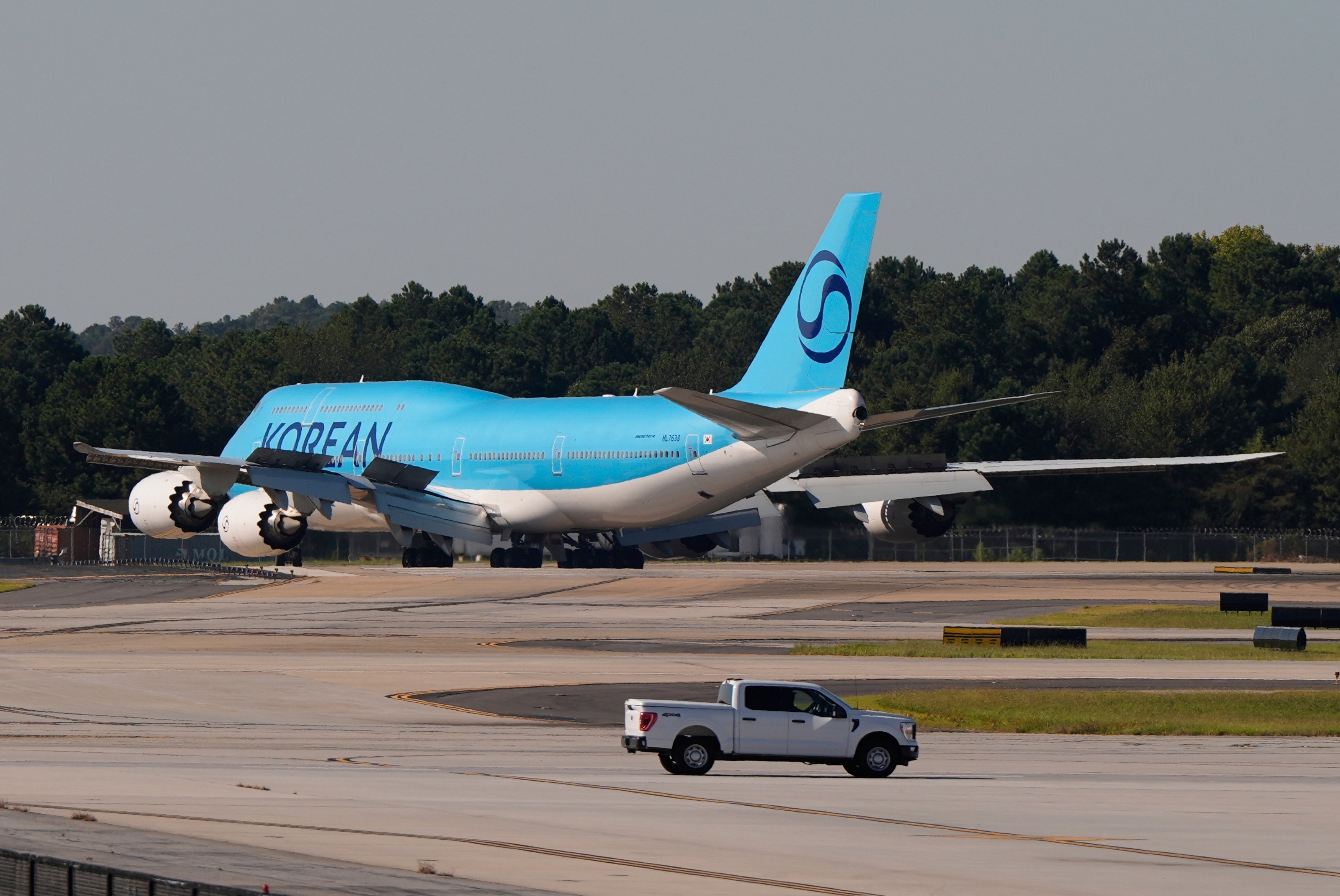 A Korean Air plane arrives at Hartsfield-Jackson International Airport in Atlanta Wednesday. The plane was expected to take the workers back home.