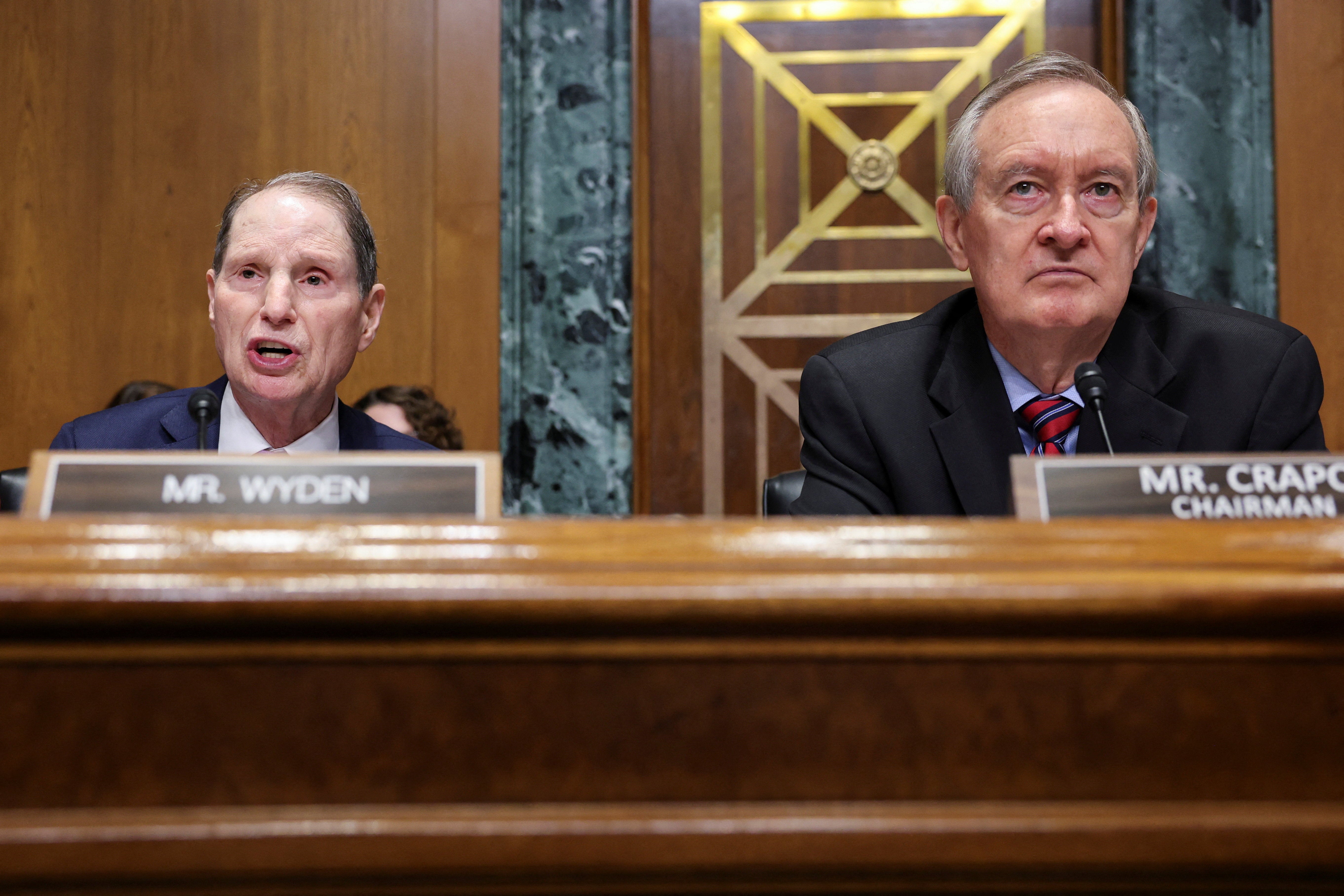 Sen. Ron Wyden, left, the top Democrat on the influential Senate Finance Committee, is trying to force the Treasury Department to release Epstein banking records as his office investigates the money-trail surrounding the sex offender’s alleged trafficking scheme