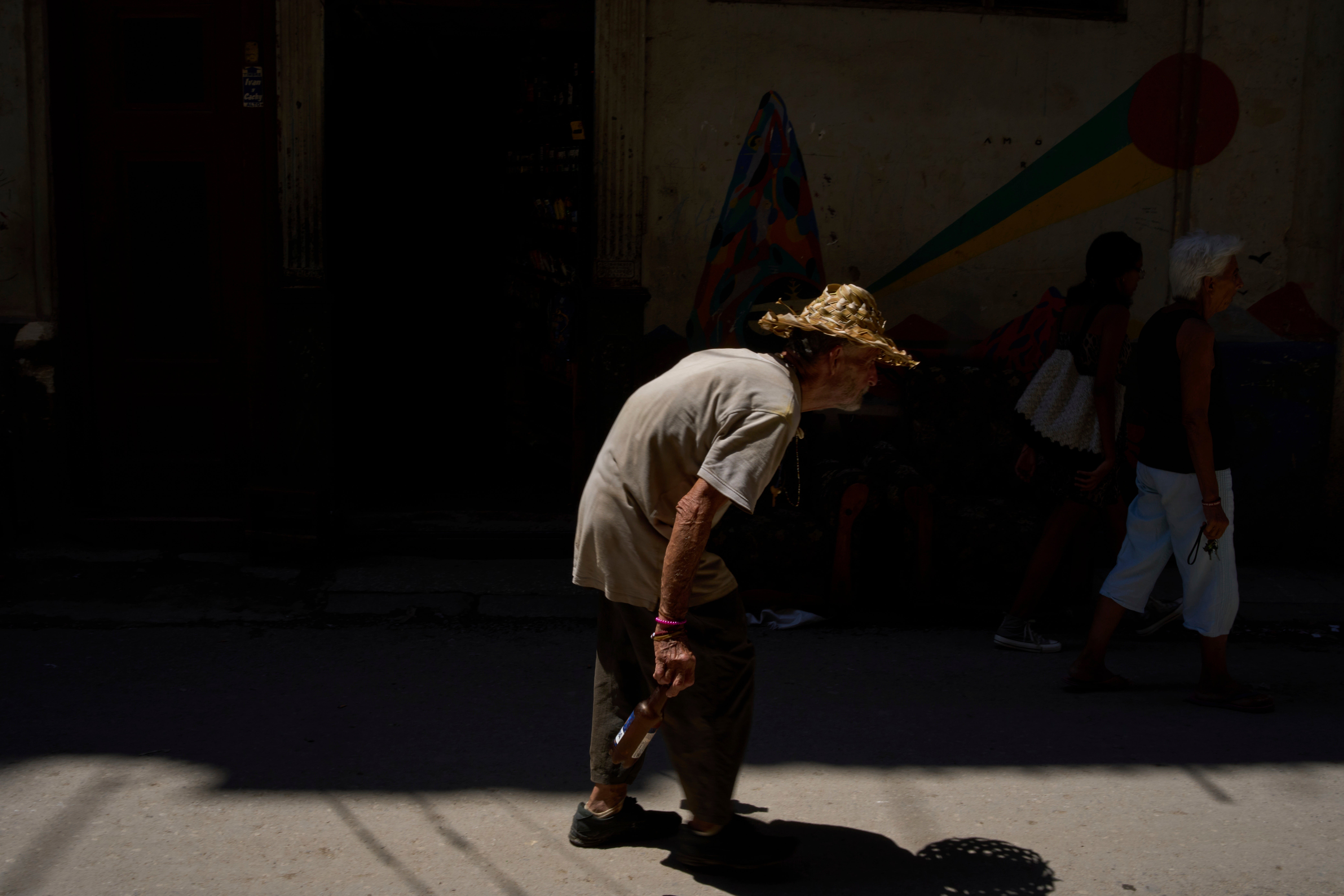 A pedestrian pictured during a blackout in Havana
