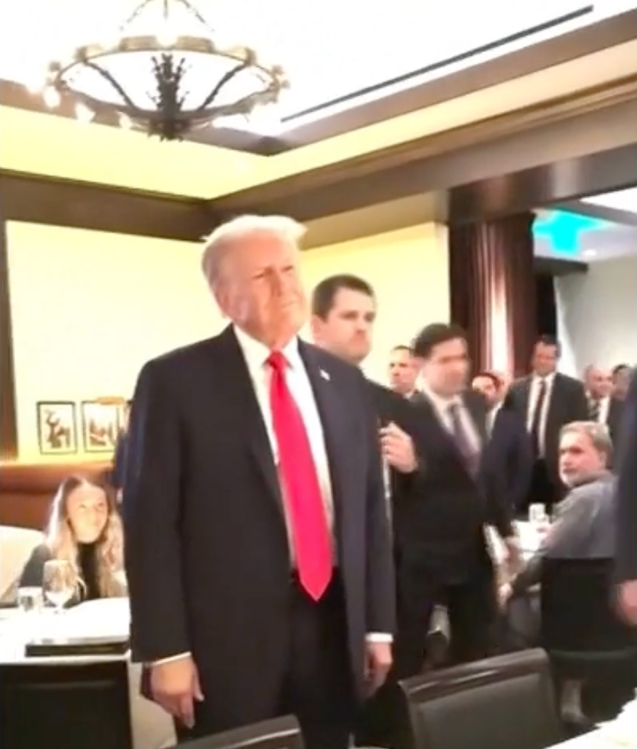 Trump was confronted by protesters before he sat down to eat