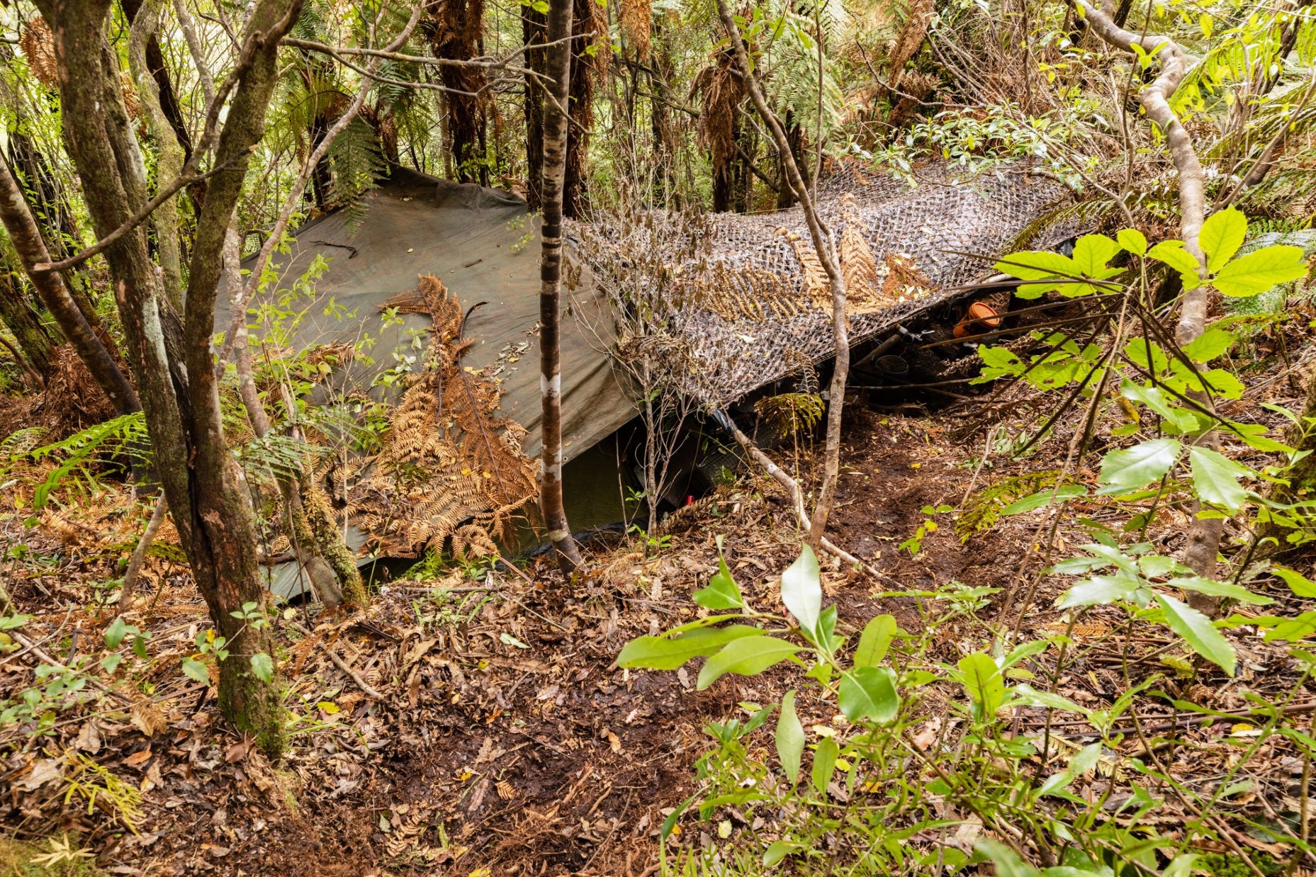 A hidden bush campsite near Waitomo, where fugitive Tom Phillips and his children were living, shown in photos released by New Zealand Police