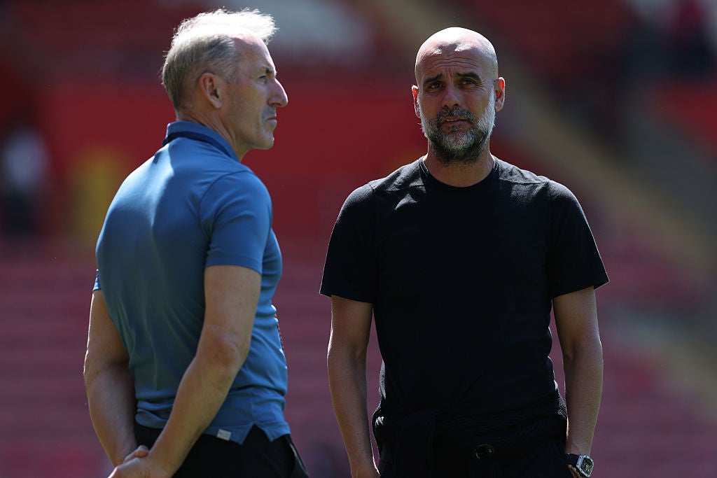 Txiki Begiristain (left) and Pep Guardiola in conversation ahead of Man City's meeting with Southampton last season