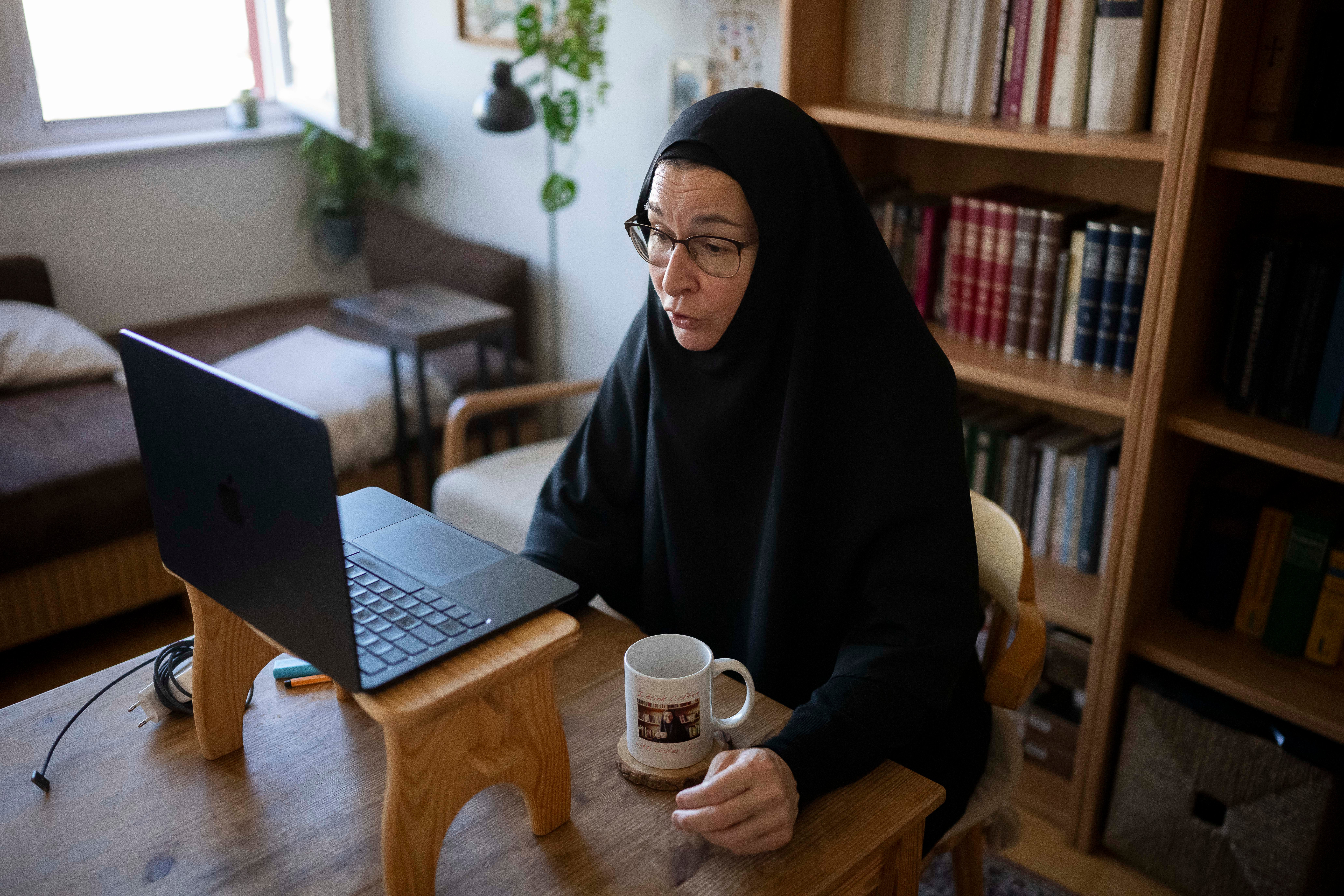 Sister Vassa Larin, a prominent American Orthodox nun, public speaker and YouTube presenter, records one of her videos in Vienna, Austria, on Wednesday, Sept 3. 2025. (AP Photo/Denes Erdos)