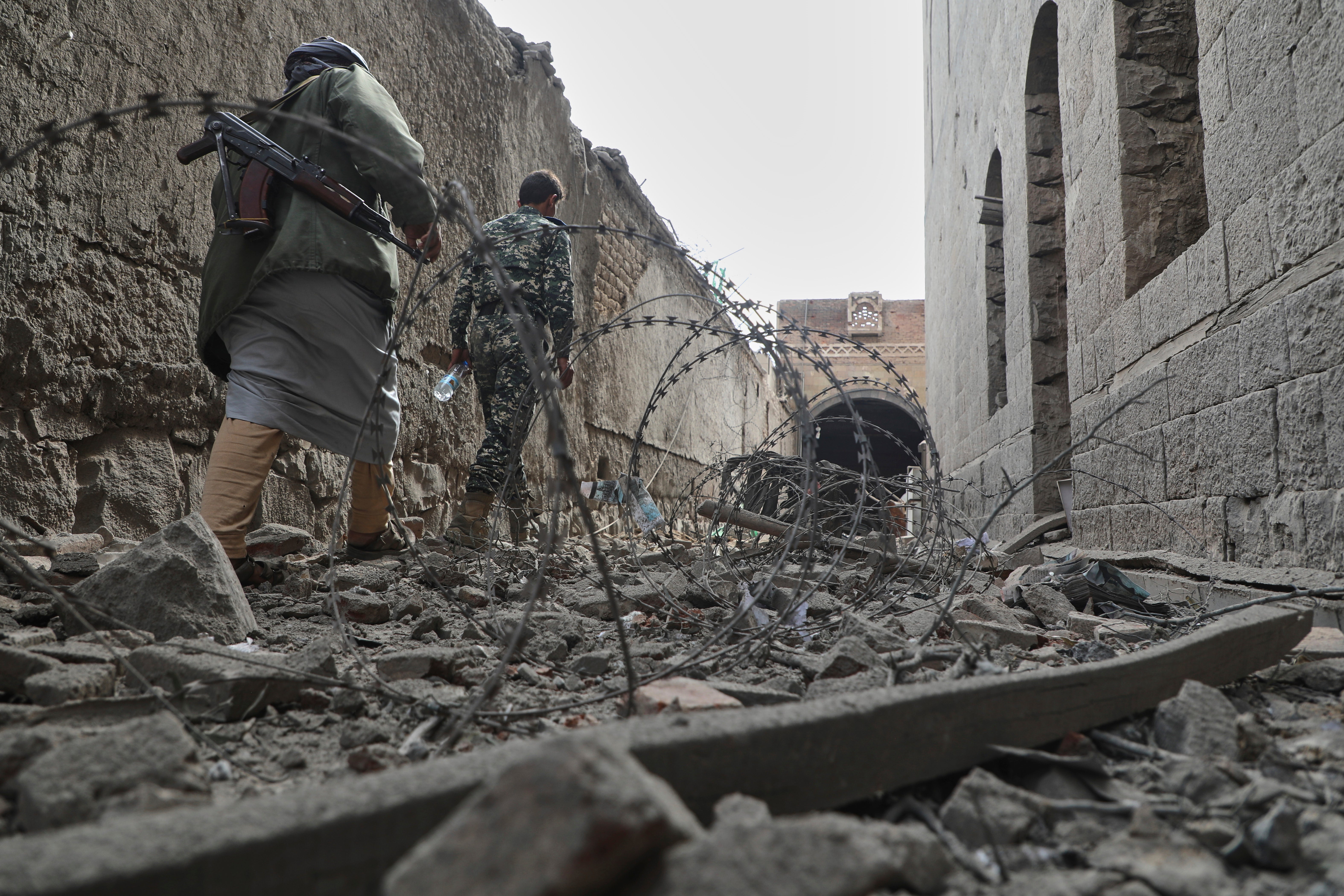 People inspect the damage at the National Museum in Yemen after airstrikes earlier this year