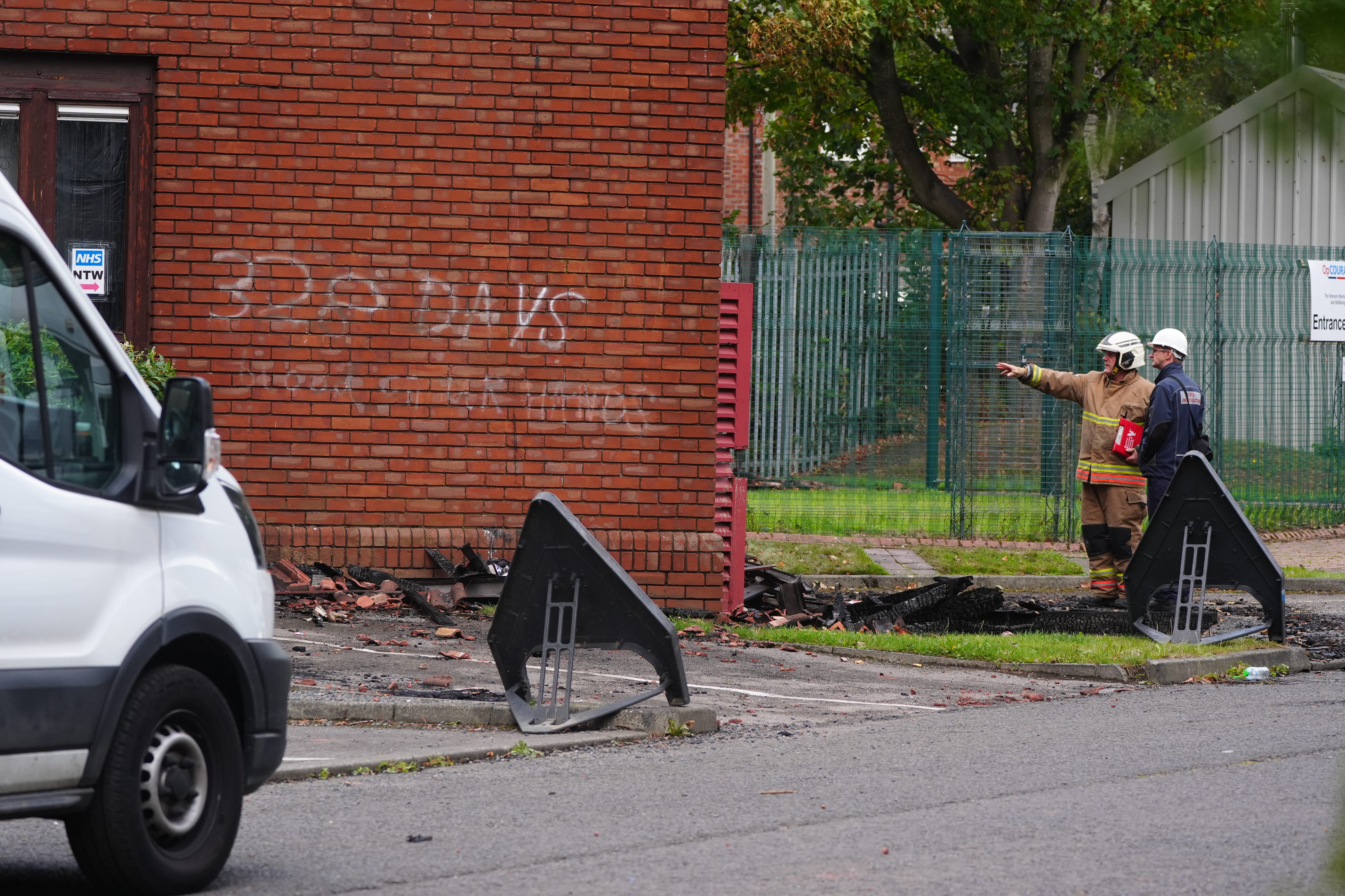 Graffiti on a wall as emergency services look the scene at the MP for Washington and Gateshead South Sharon Hodgson’s office (Owen Humphreys/PA)
