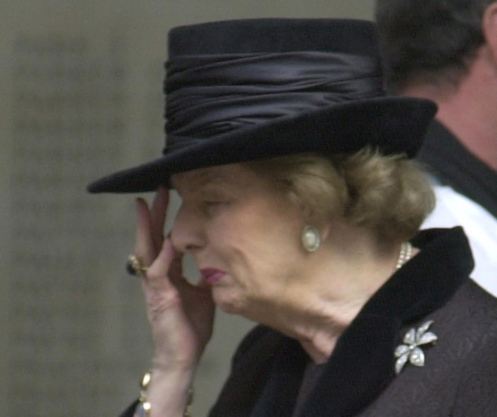 Lady Thatcher wipes away tears after the memorial service for Sir Denis Thatcher in 2003