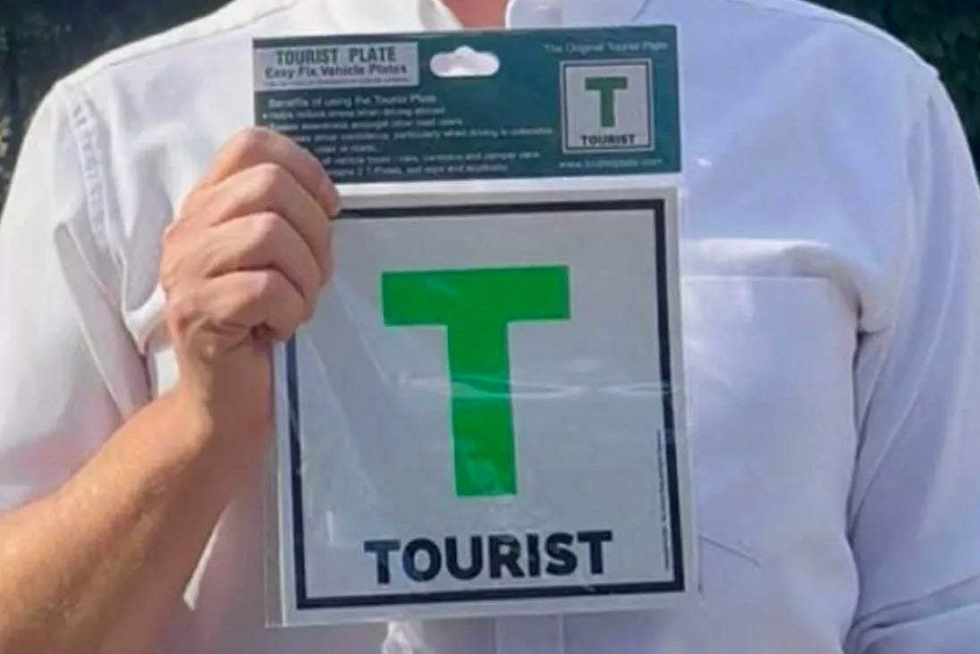 The green “T plates” have "tourist" written at the bottom