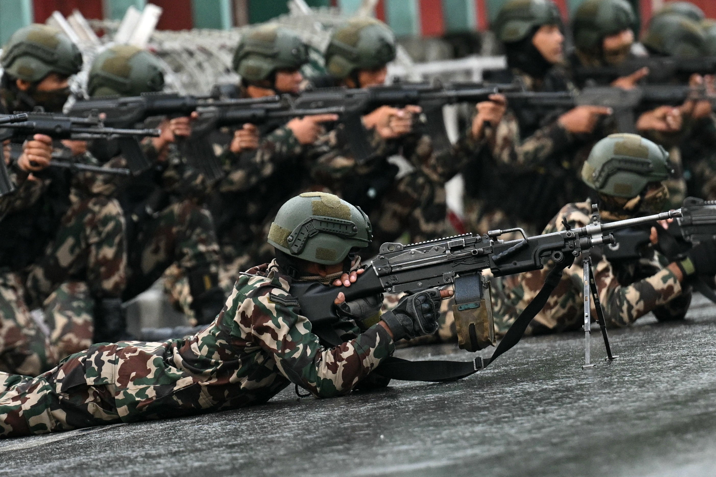 Soldiers take their positions to disperse protesters in Kathmandu on Friday