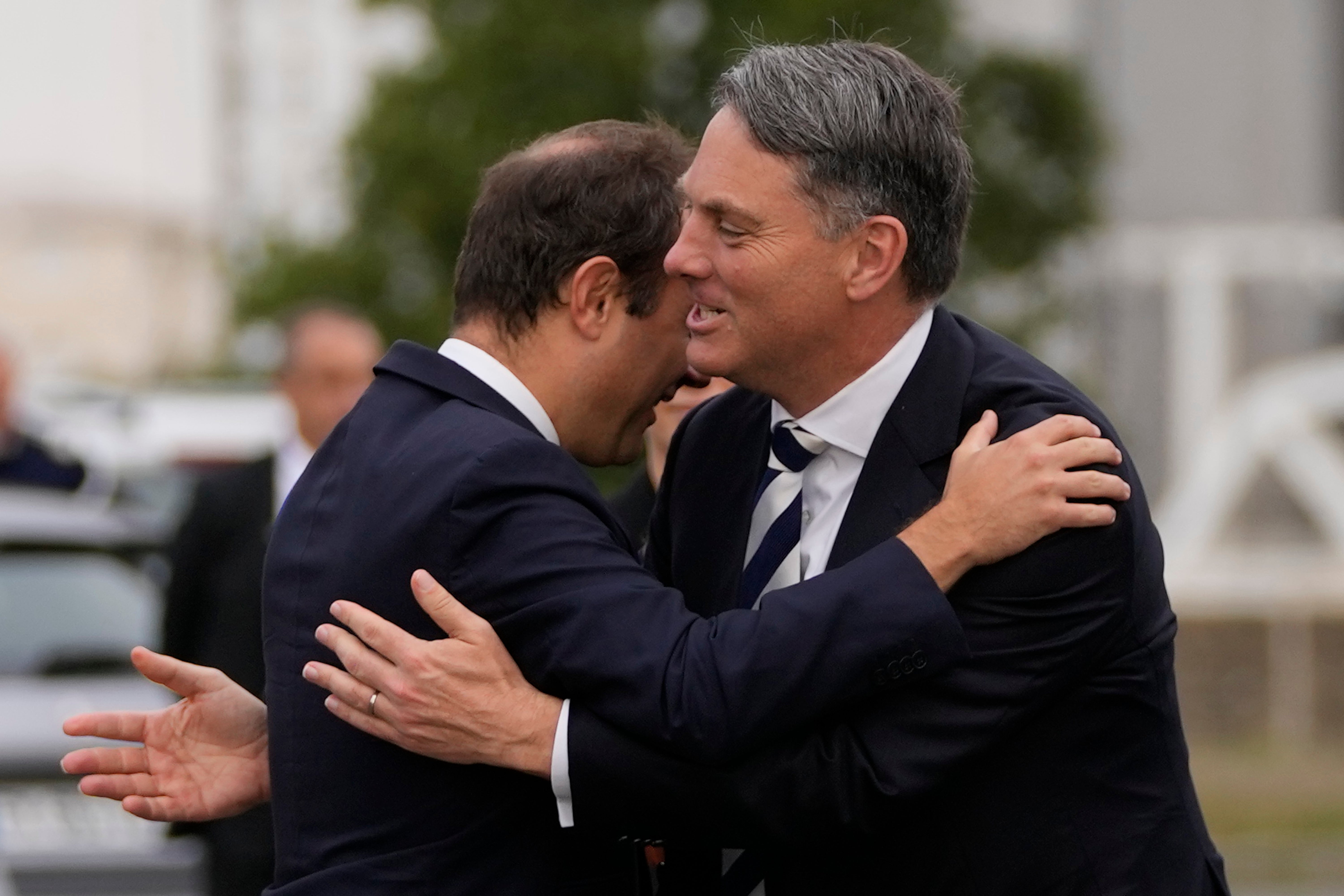 French Defense Minister Sebastien Lecornu, left, welcomes Deputy Prime Minister of Australia and Minister for Defense Richard Marles during a ceremony on Sept. 1, 2022, in Brest, Brittany, France. (AP Photo/Francois Mori, File)