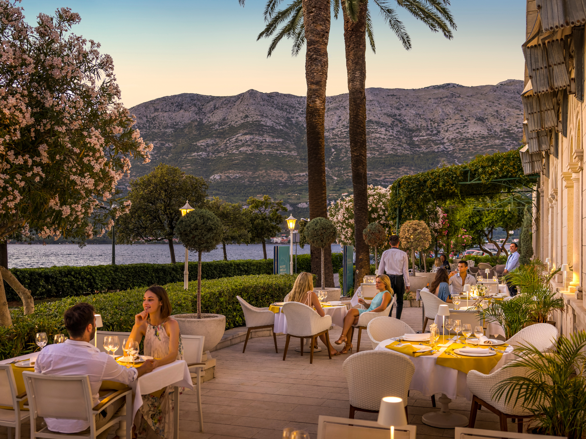 Meals are served on the outdoor terrace overlooking the yacht marina