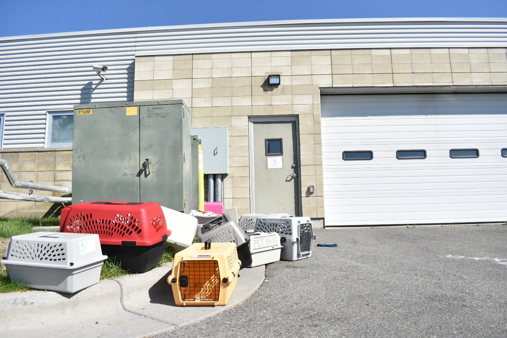 Animal crates sit outside the Yellowstone Valley Animal Shelter after smoke filled the building