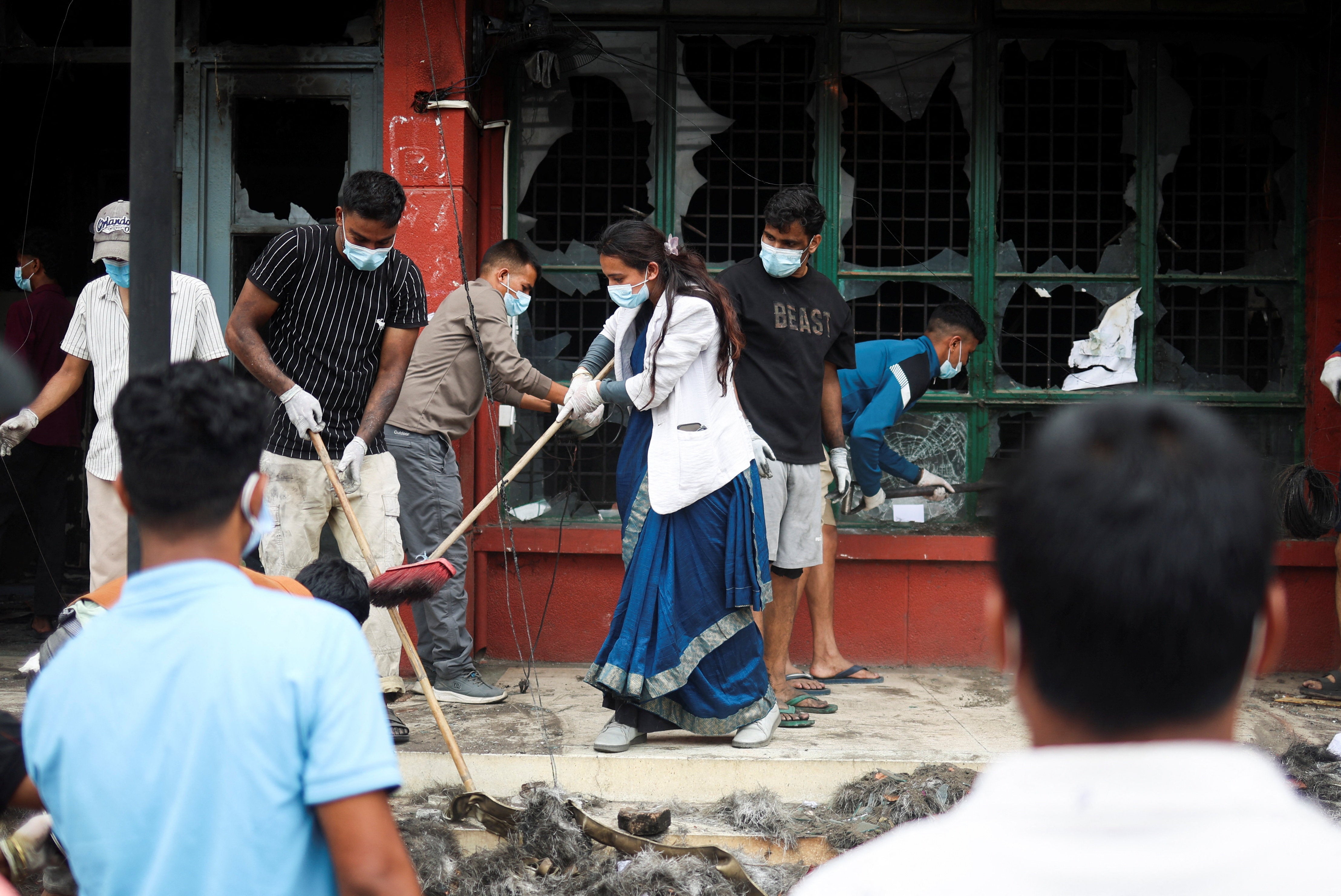 Damage left by days of anti-corruption protests in the Nepalese capital is cleaned up