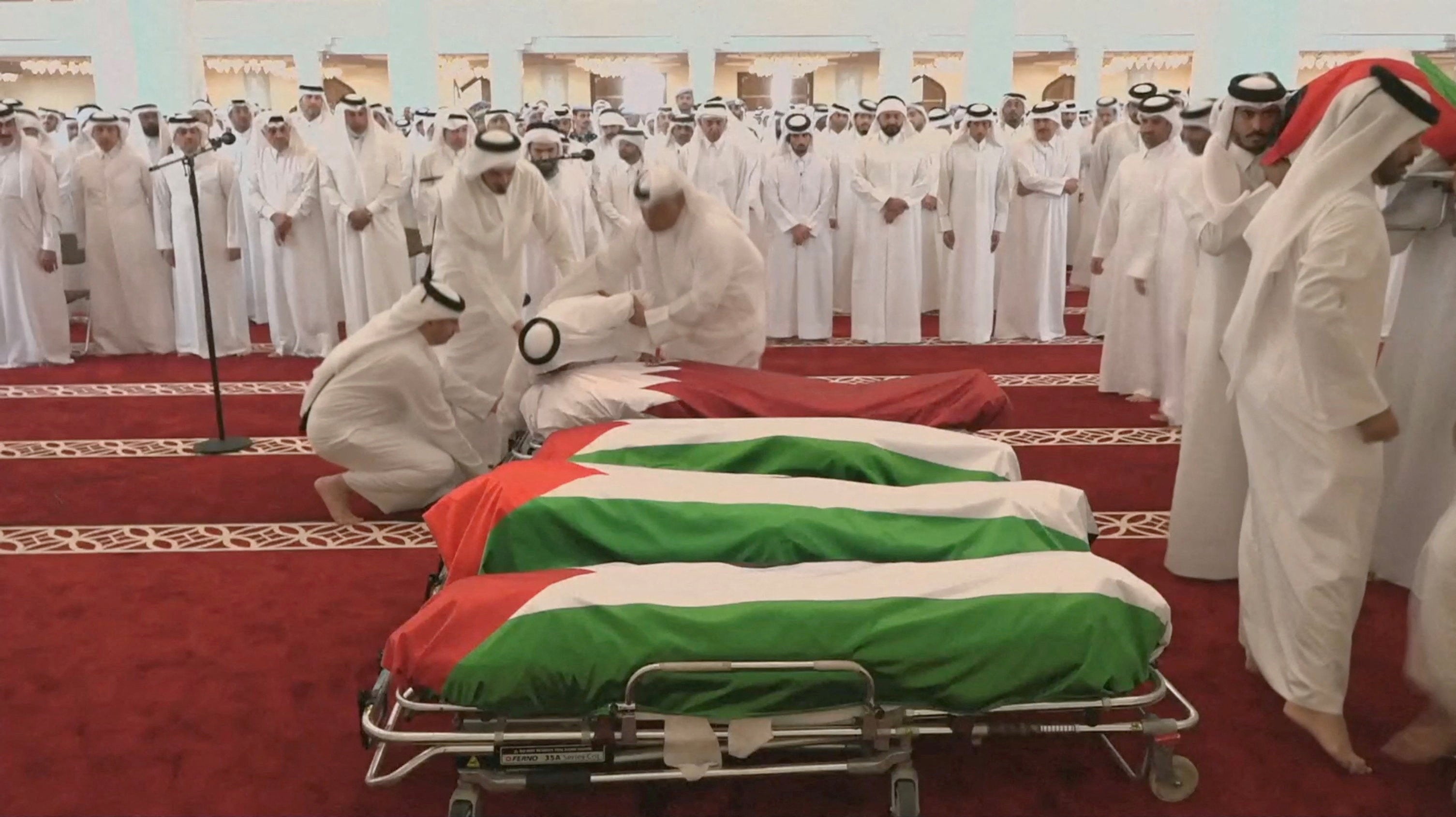 People attend a funeral held for those killed by an Israeli attack in Doha