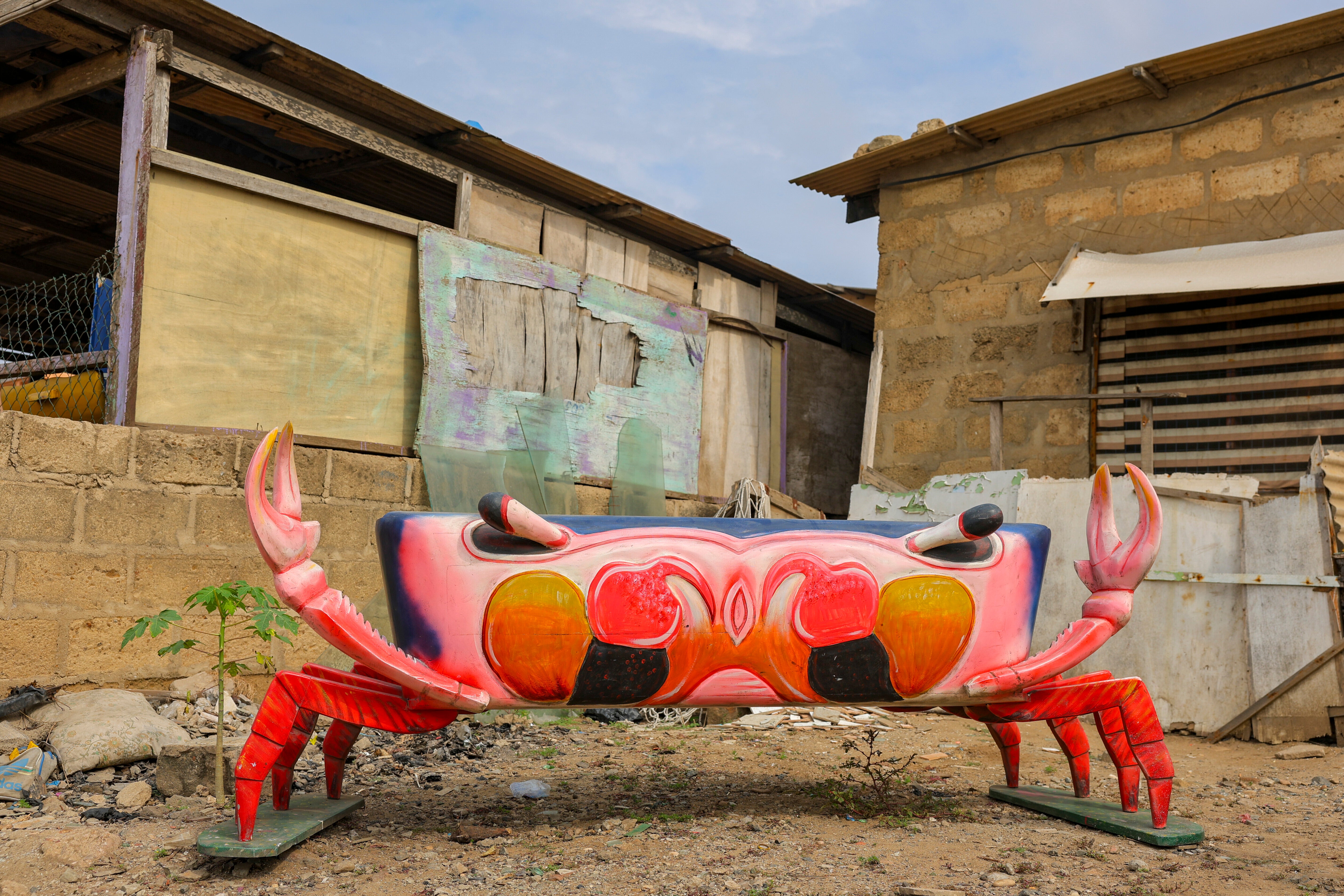 A crab fantasy coffin crafted by Eric Kpakpo Adotey is displayed by his shop in La, Accra