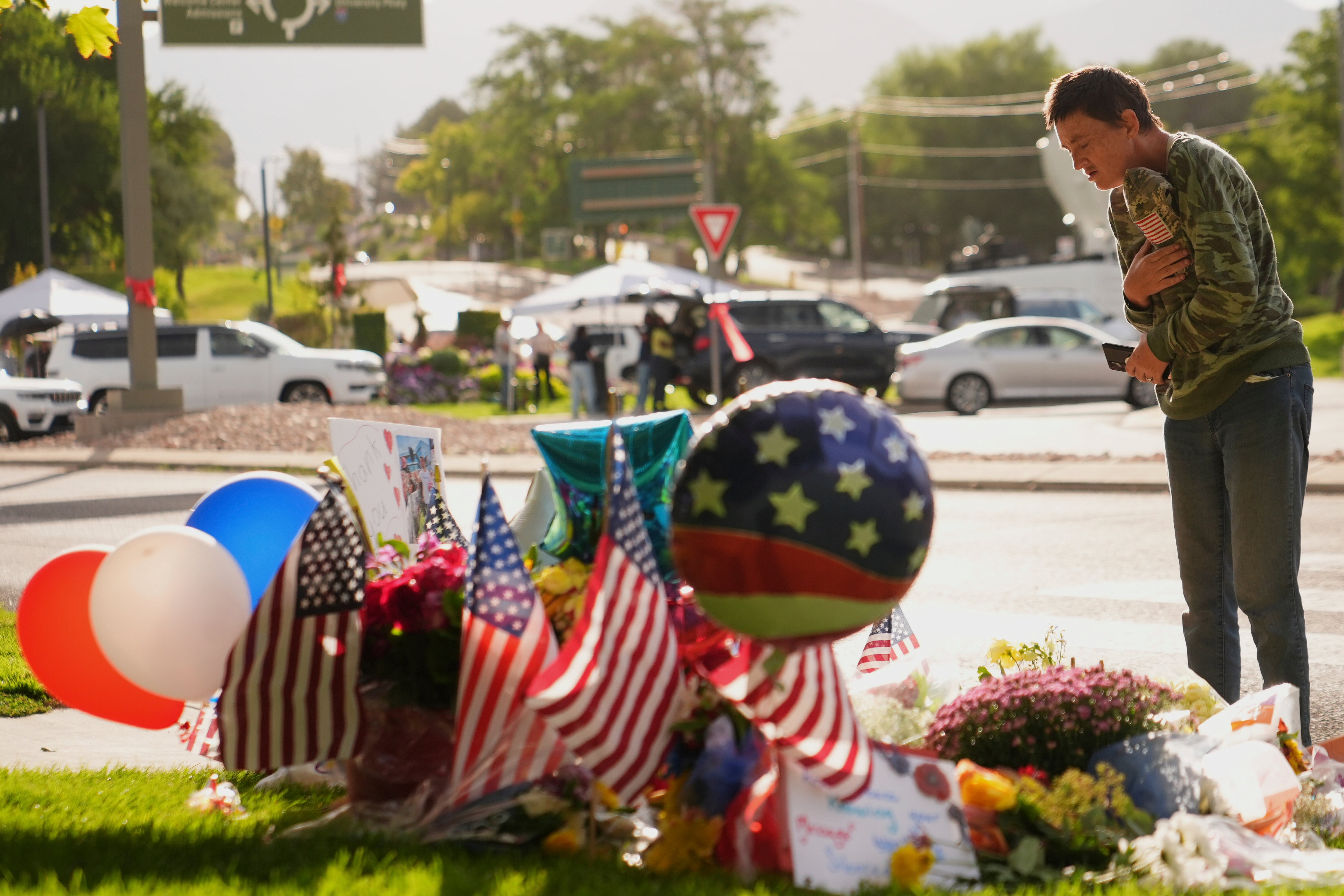 Wendy Lucas, a Utah Valley University student, looks at a memorial set up for Charlie Kirk at Utah Valley University in Orem, Utah