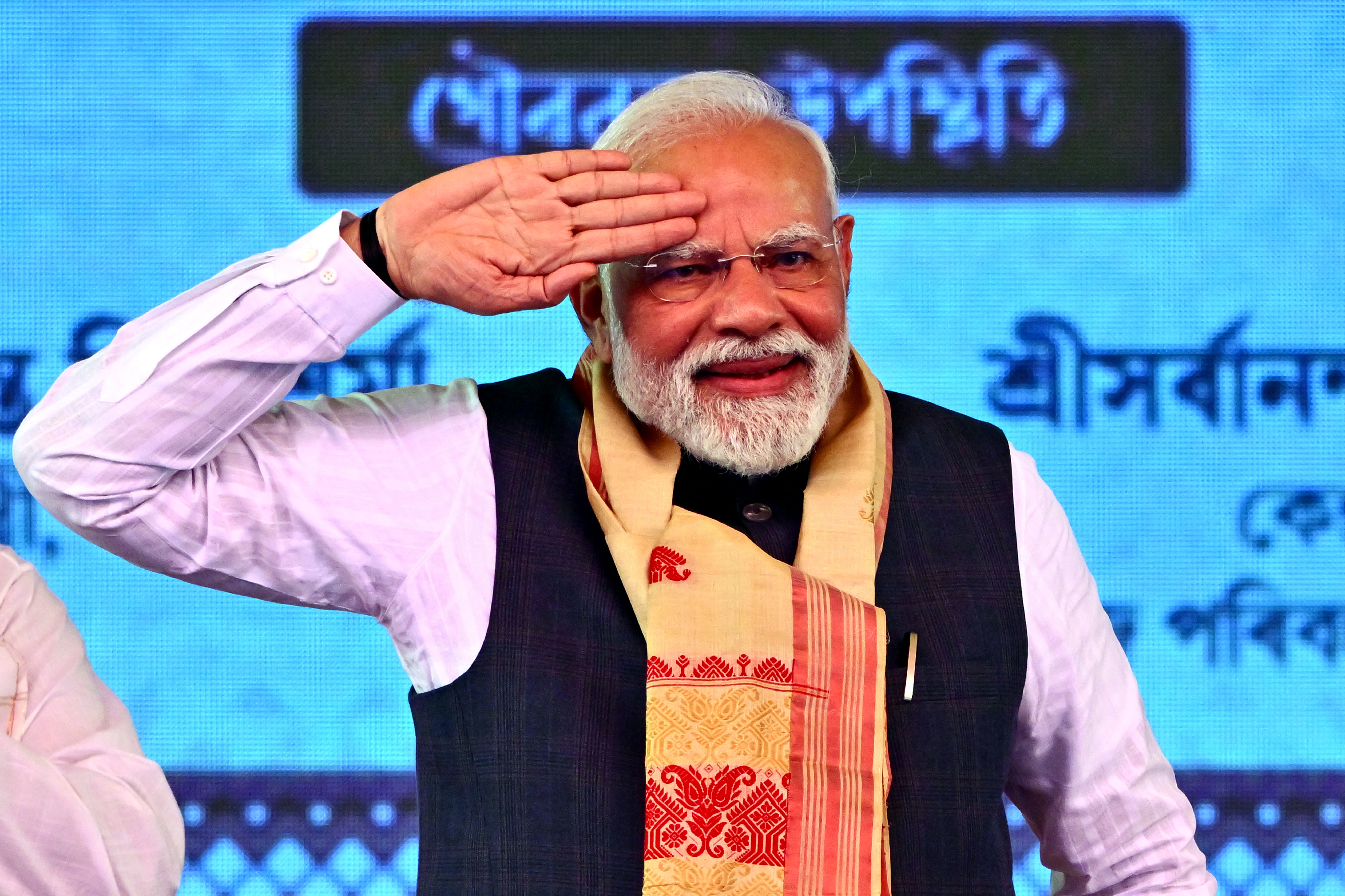 India's Prime Minister Narendra Modi gestures to supporters during a public meeting at Mangaldoi in the Darrang district of India's northeastern state of Assam