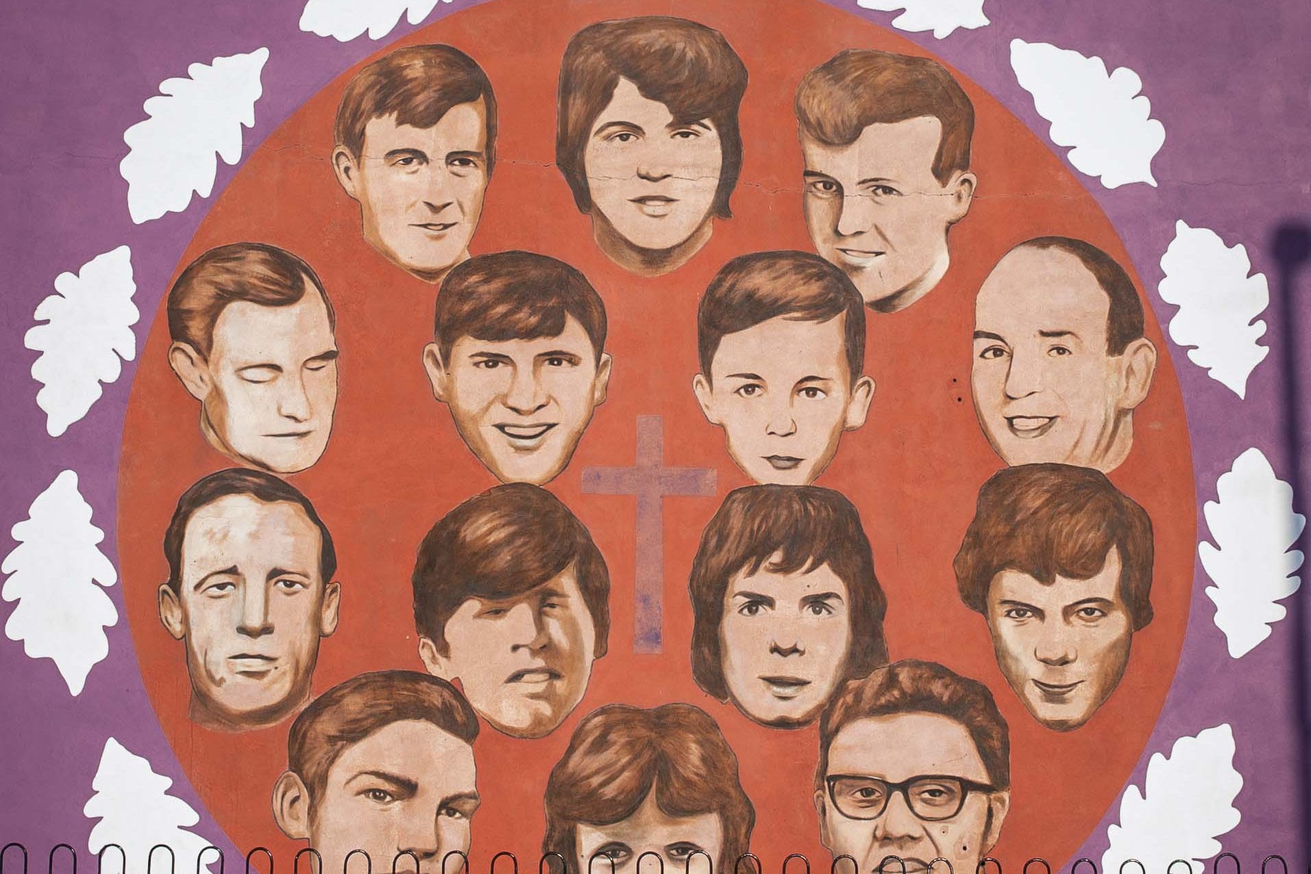 A person walks past the Bloody Sunday Commemoration mural in Northern Ireland (PA)