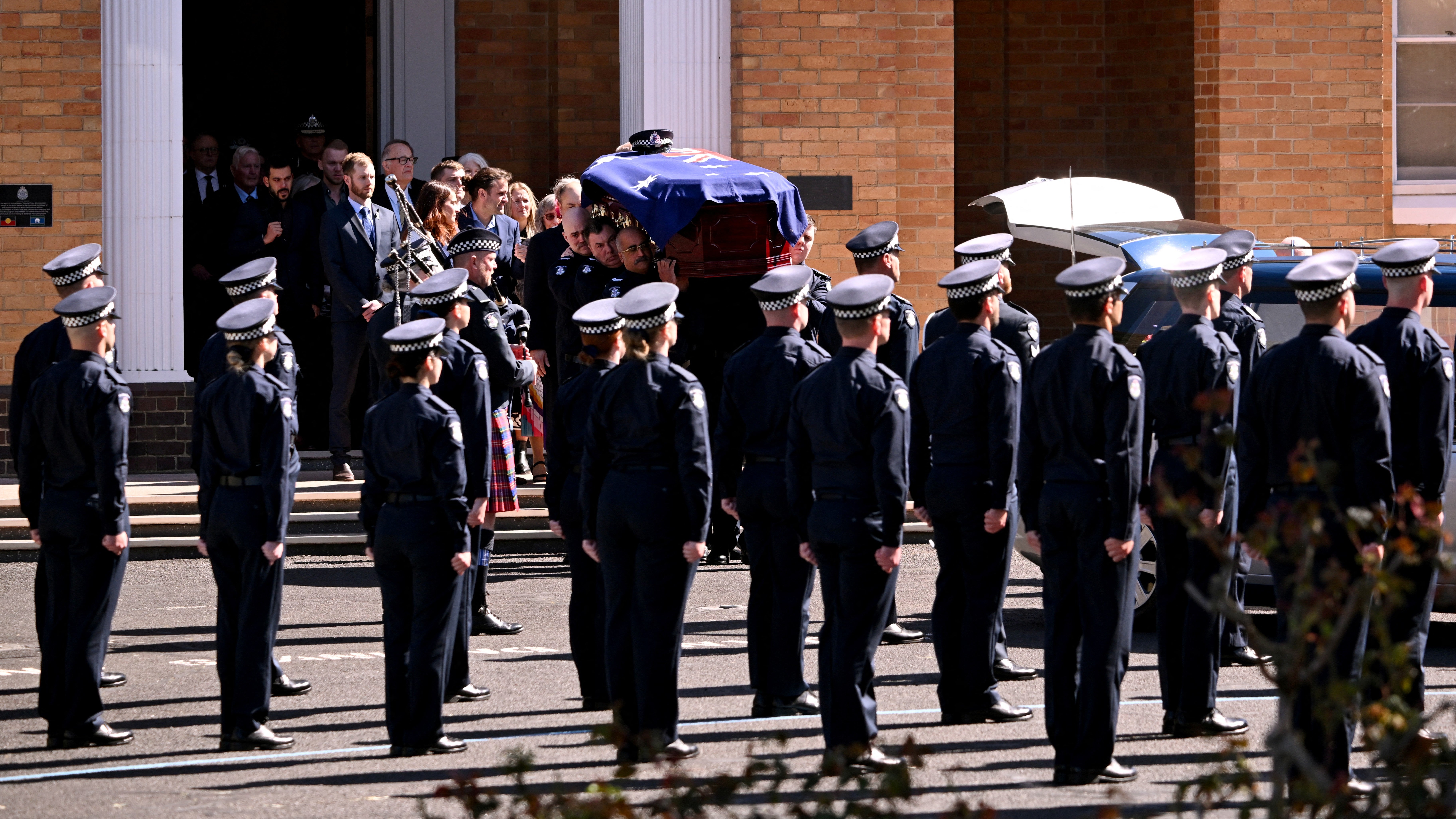 Coffin of police officer Senior Constable Vadim de Waart-Hottart, killed in a shooting at Porepunkah in Victoria's north-east last week