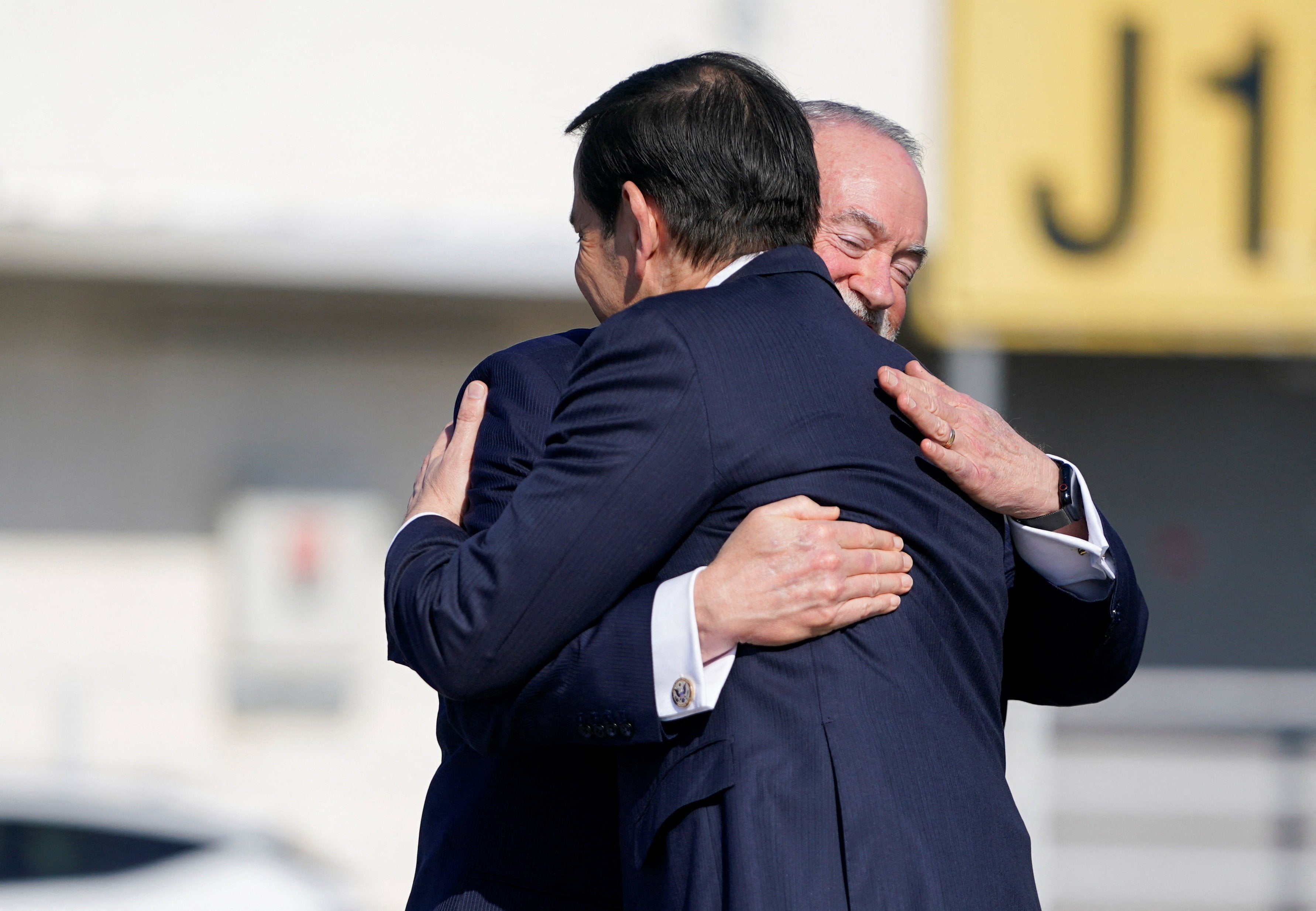 US Secretary of State Marco Rubio is greeted upon arrival by US Ambassador to Israel Mike Huckabee, at Ben Gurion International Airport