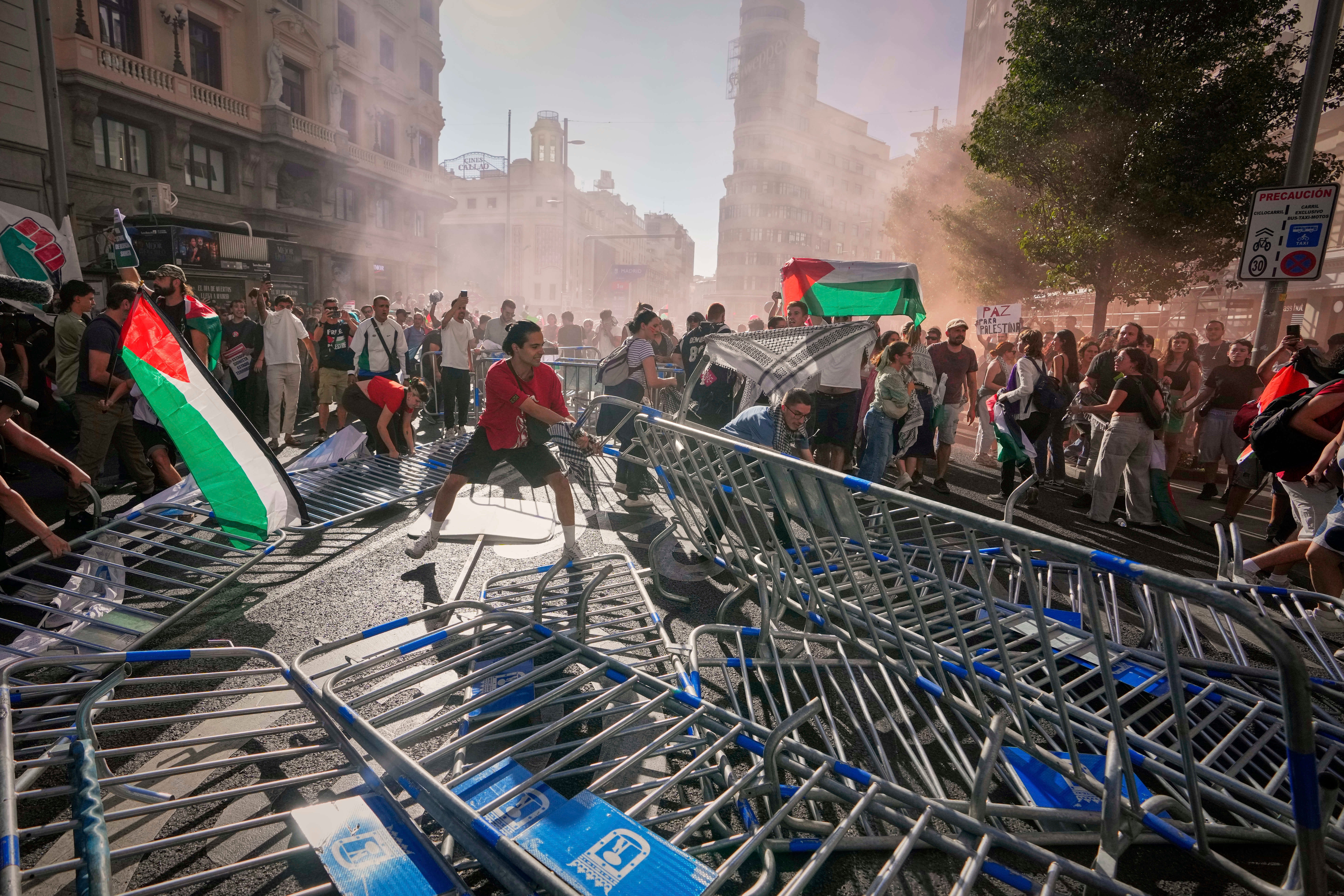 Protesters block the road in Madrid on stage 21