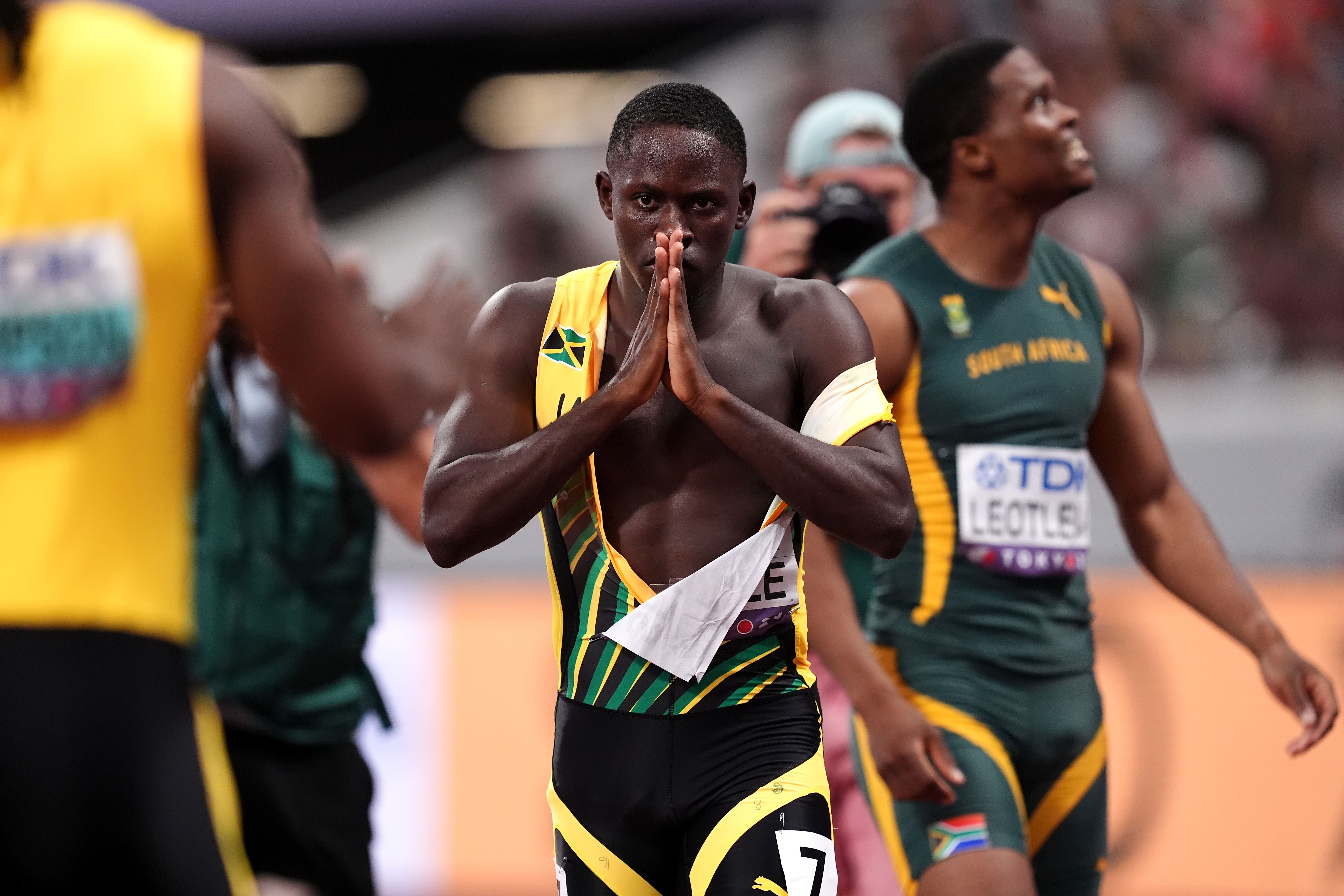 Oblique Seville reacts after winning gold in the men’s 100 metres in Tokyo (Martin Rickett/PA)