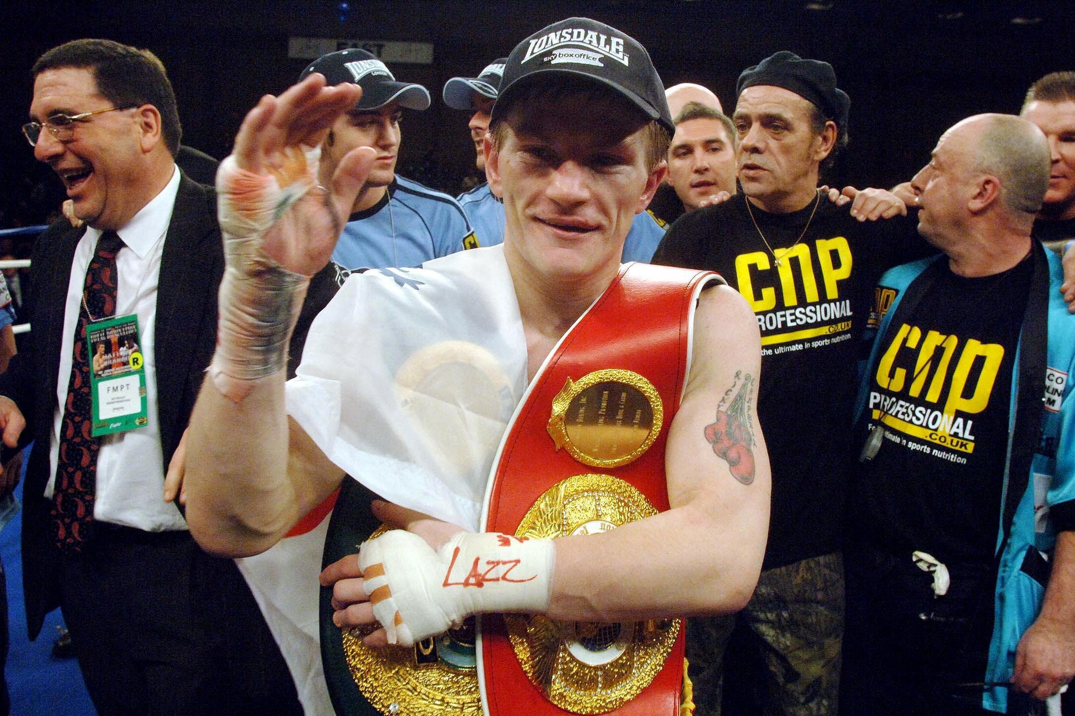 Ricky Hatton celebrates with his IBF & IBO light-welterweight belts after victory over Juan Urango in 2007 (Sean Dempsey/PA)