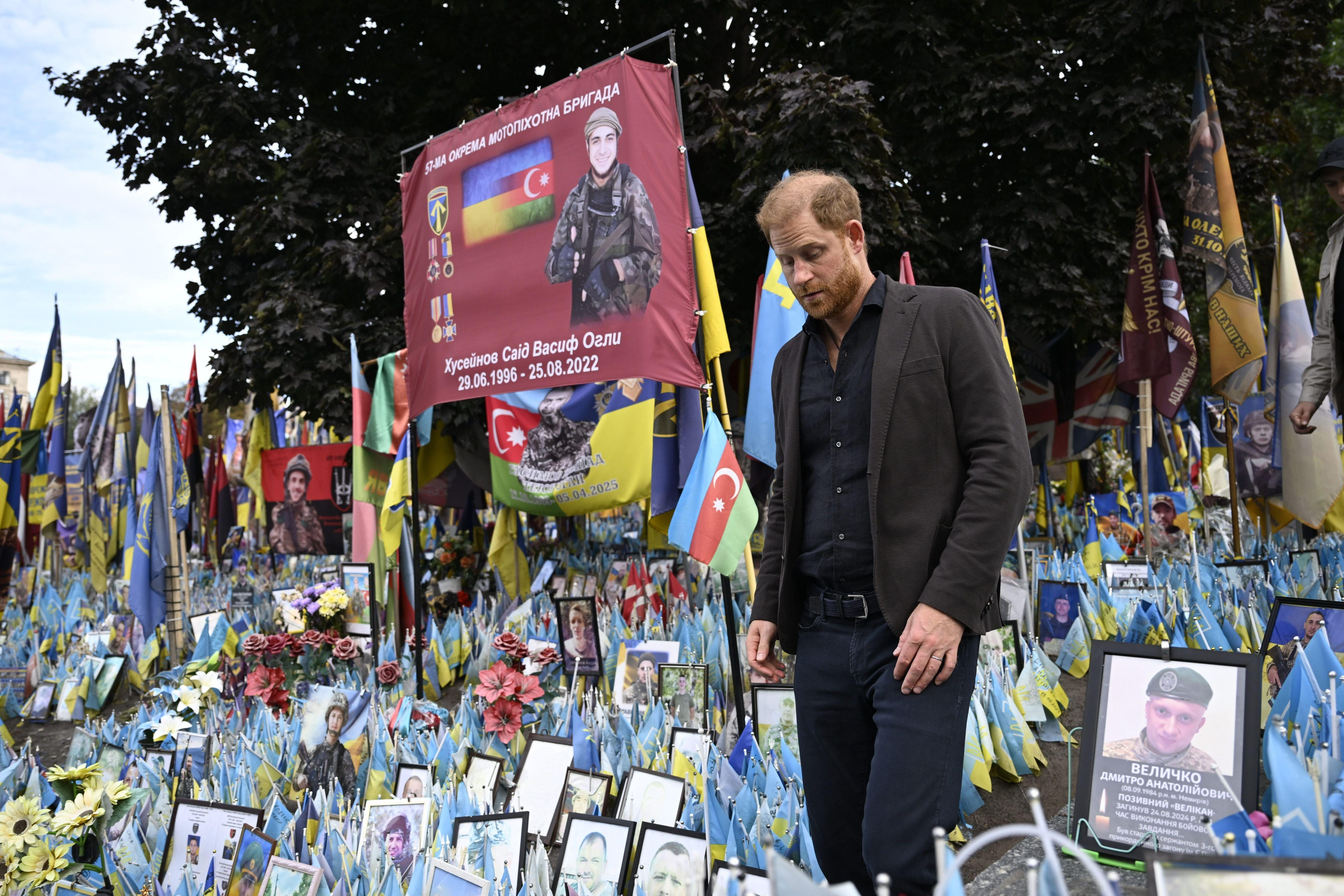 The Duke of Sussex visits the memorial for all those who have died during the conflict with Russia at Independence Square in Kyiv