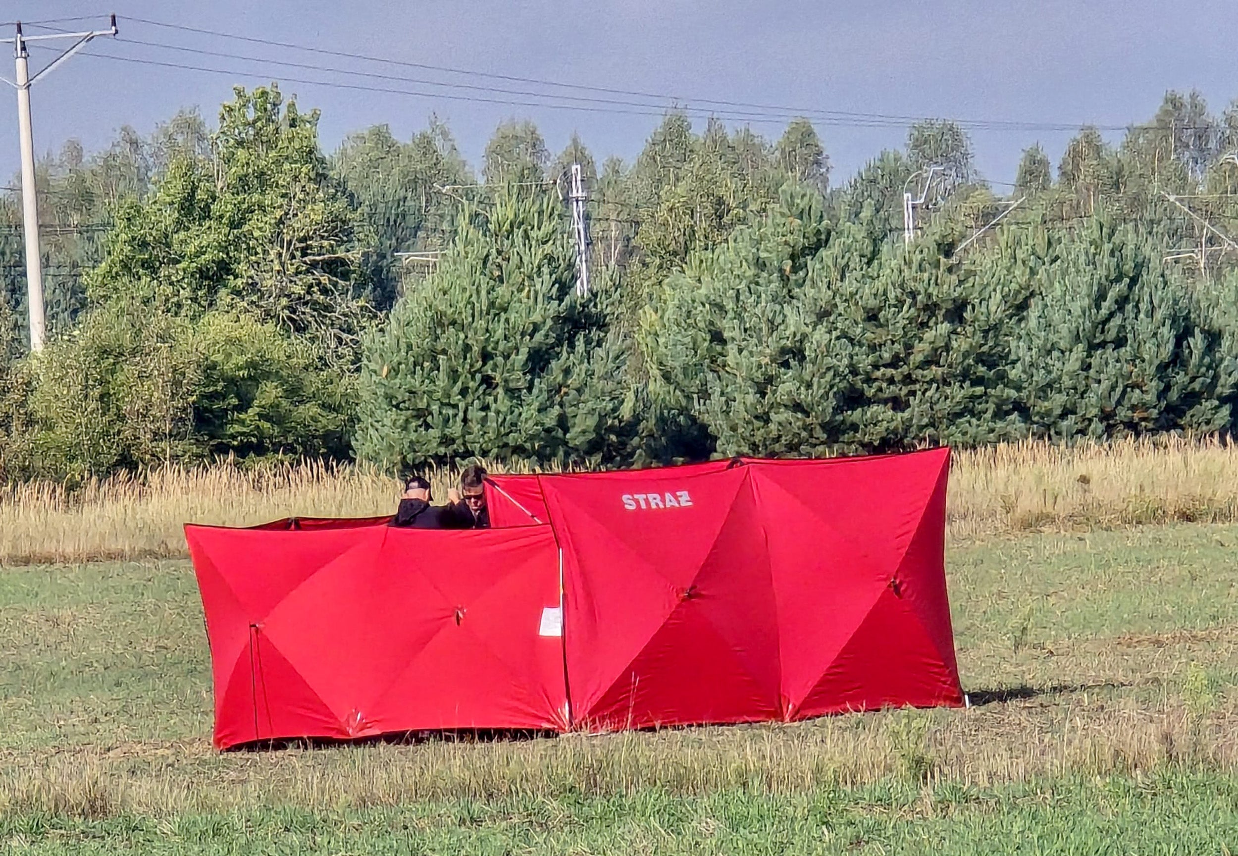 Investigators inspect a site where it is believed that parts of a Russian drone fell, probably after it was shot down, in Czosnowka near Biala Podlaska, Poland, on 10 September 2025